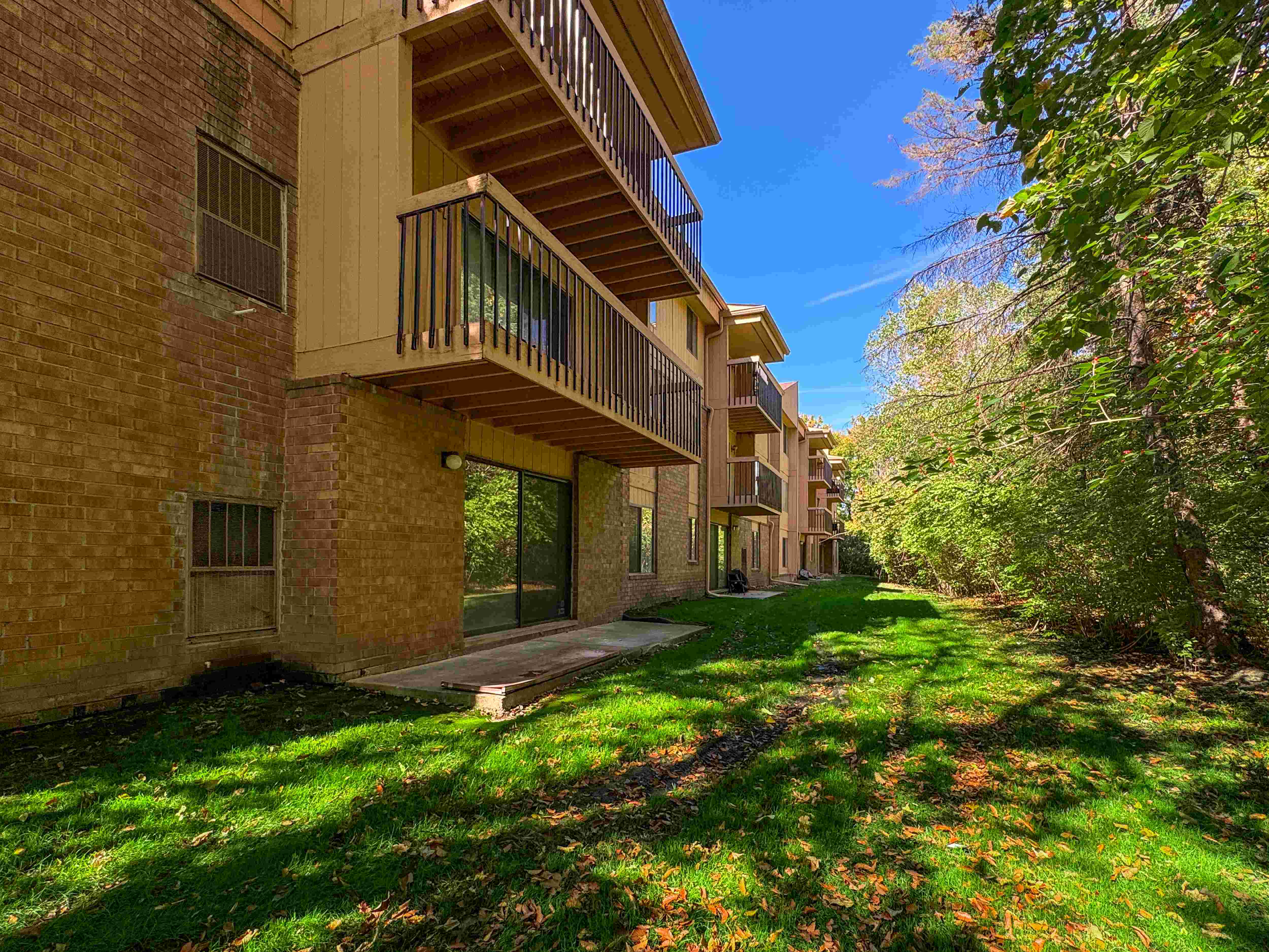 Expansive Green Space Apartment Building Exterior at Franklin River Apartments, Southfield, MI