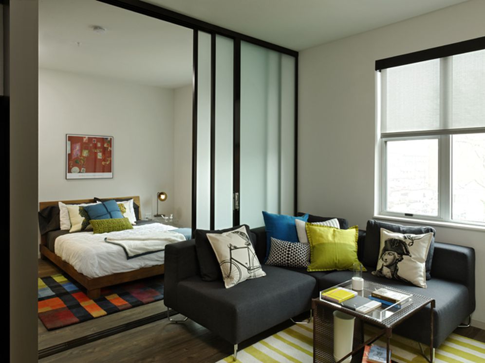 Urban living room and bedroom with hard surface flooring