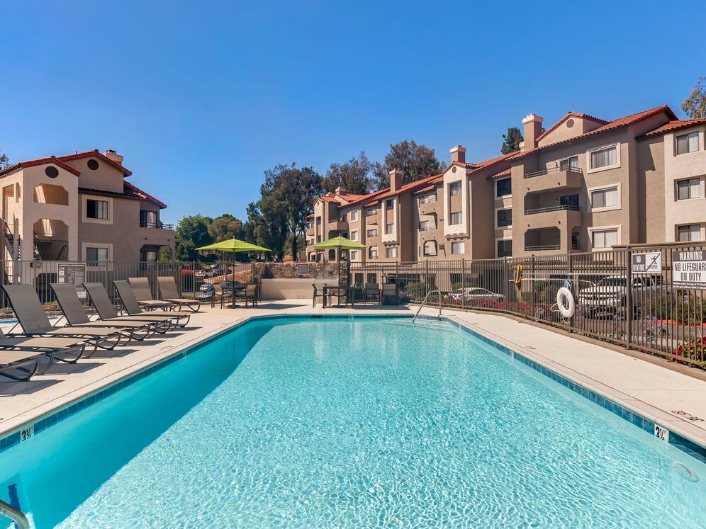 Swimming pool and sundeck with lounge seating