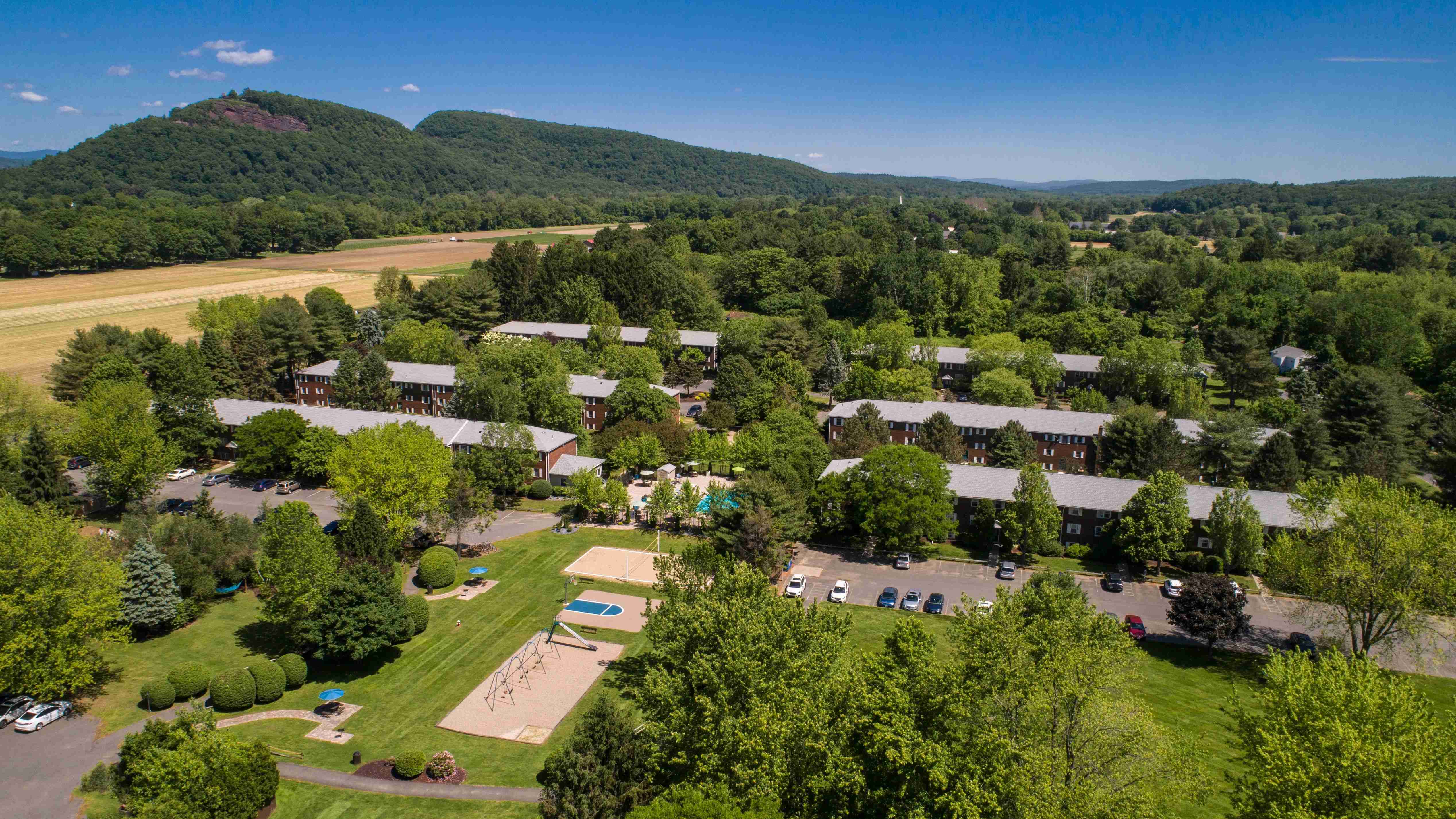 Marvel at an aerial view of our expansive 22-acre Sugarloaf Estates, nestled among natural beauty. 