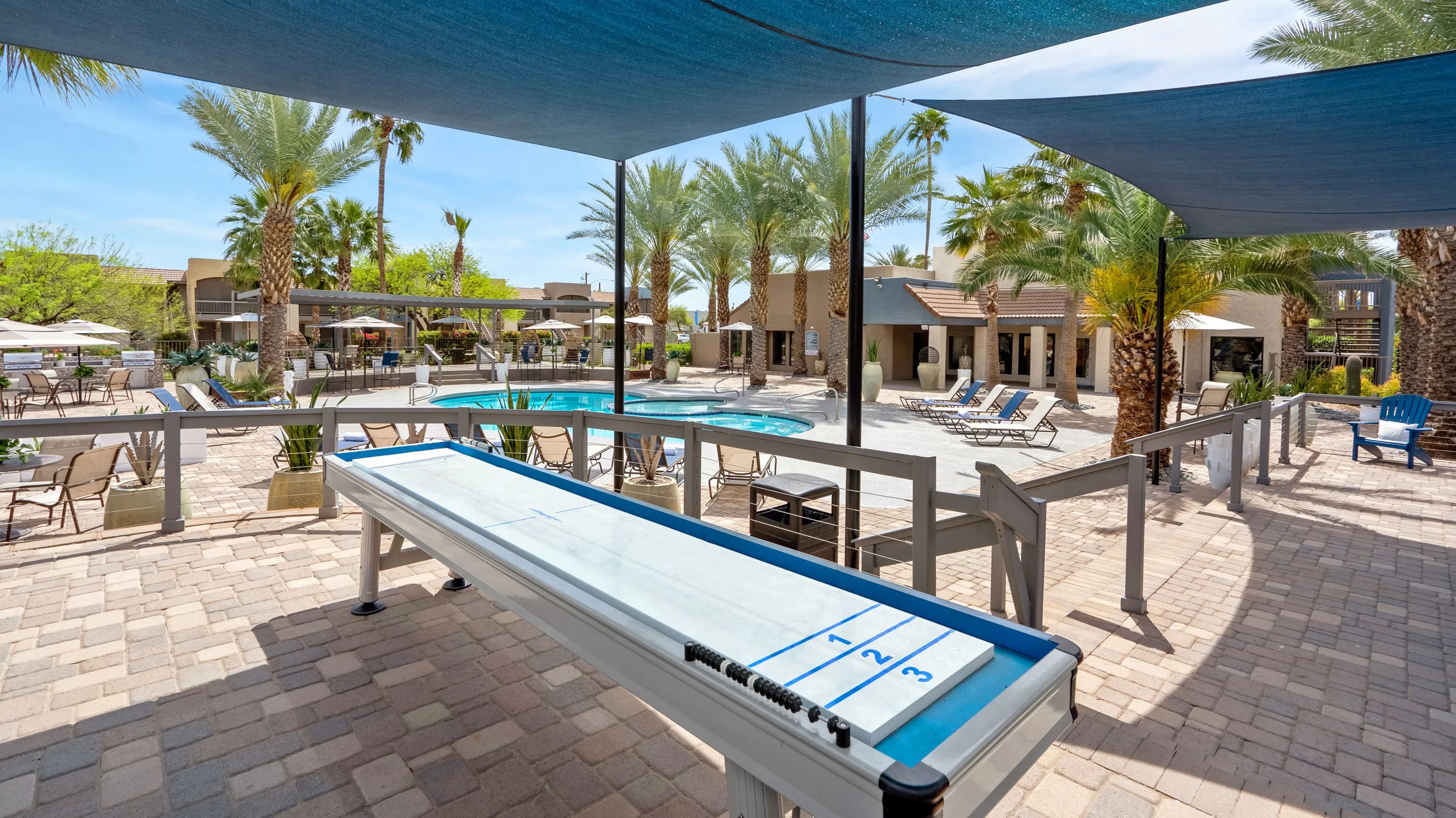  Join the spirited shuffleboard games by the pool where the shade keeps you cool and the competition heats up. 