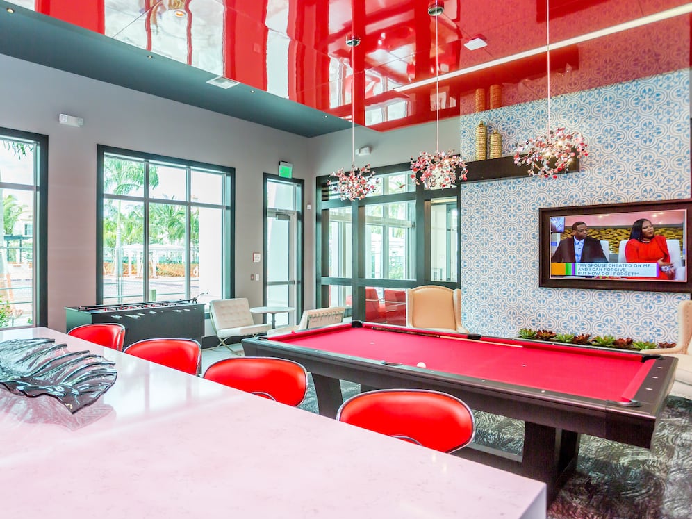 Resident lounge with game area and TV