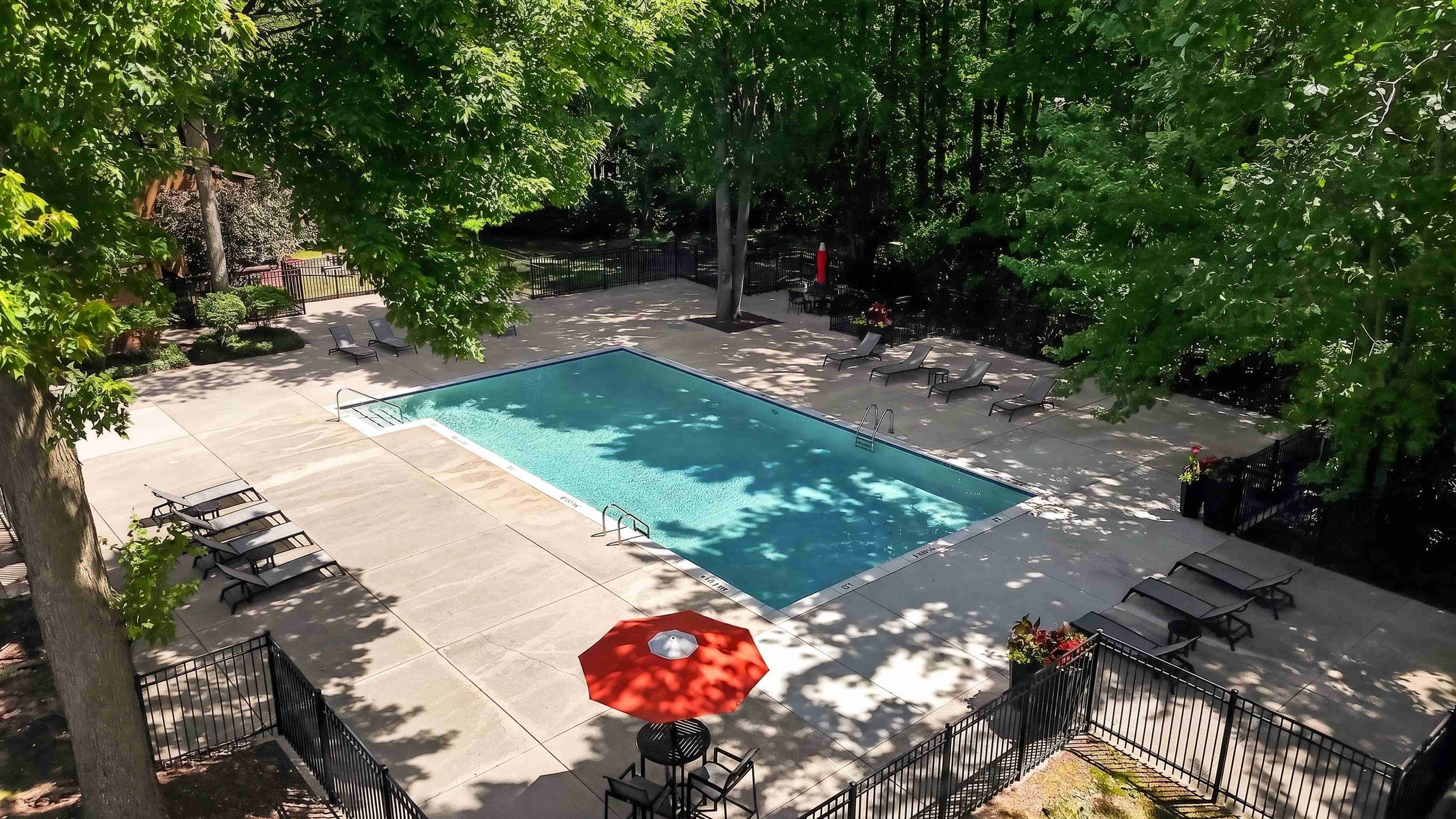 Heated pool with sundeck at Eastwood Village Apartments in Clinton Township, MI.