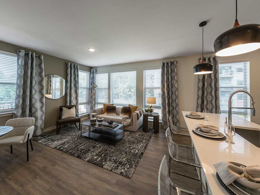 East Classic I open-concept kitchen, living, and dining areas with hard surface plank flooring