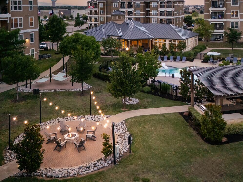 Courtyard with fireside, grill stations, and pool