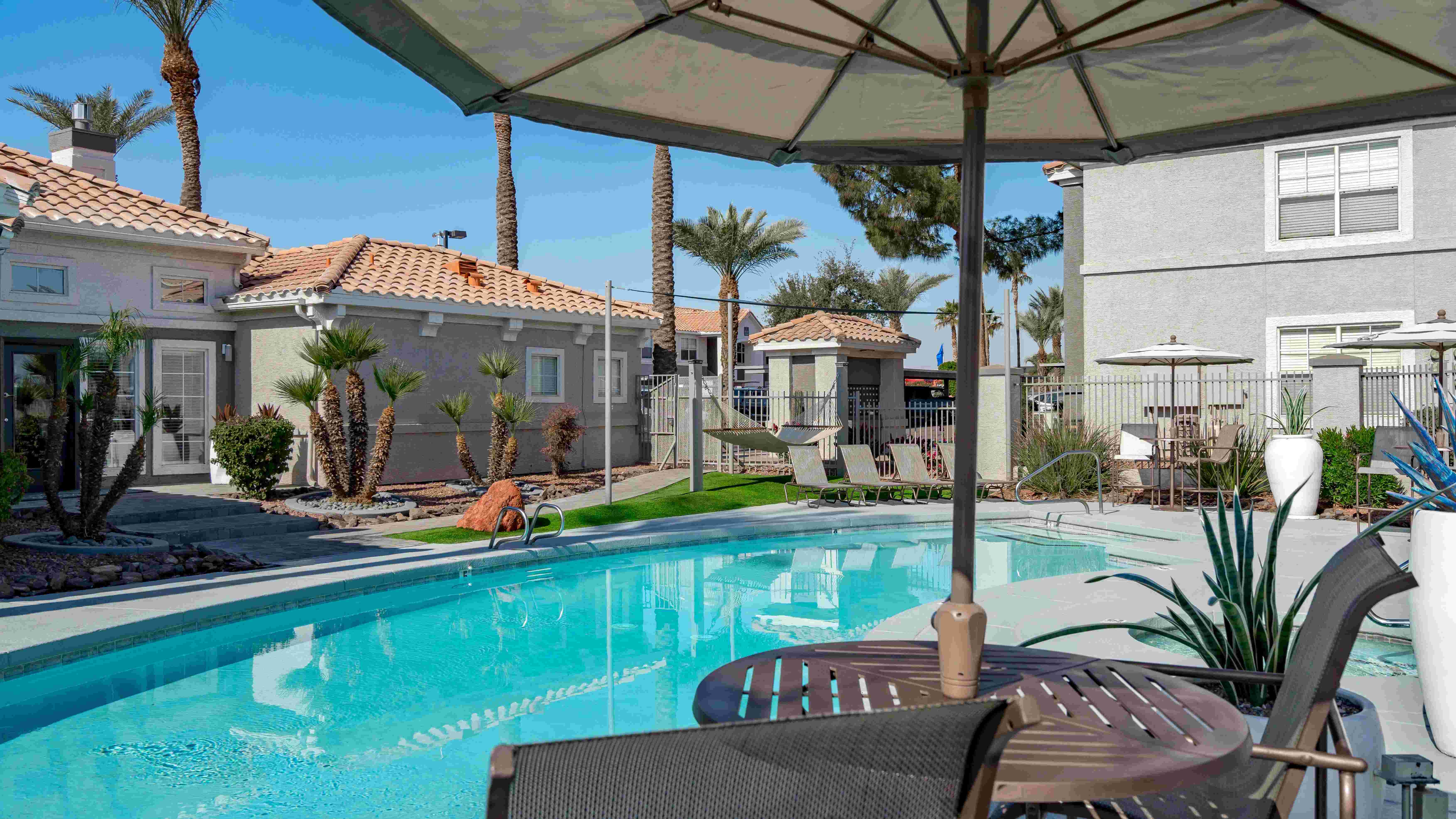 Enjoy a luxurious escape at Sedona Peaks with our resort-style pool, cozy loungers, and shaded seating—your perfect oasis in the desert.