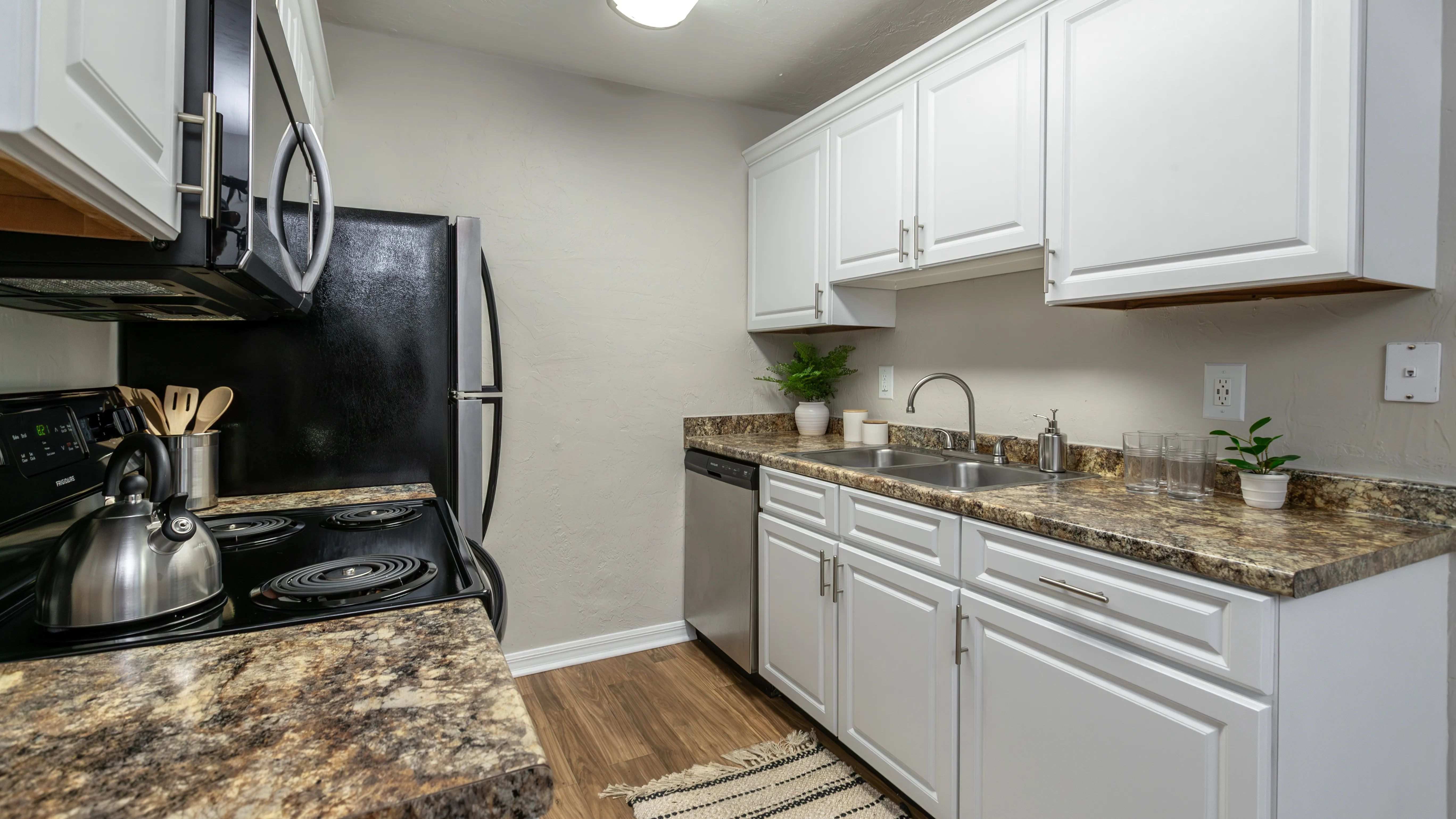 Embrace culinary creativity in our galley-style kitchens with ample cabinetry for optimal storage and organization.