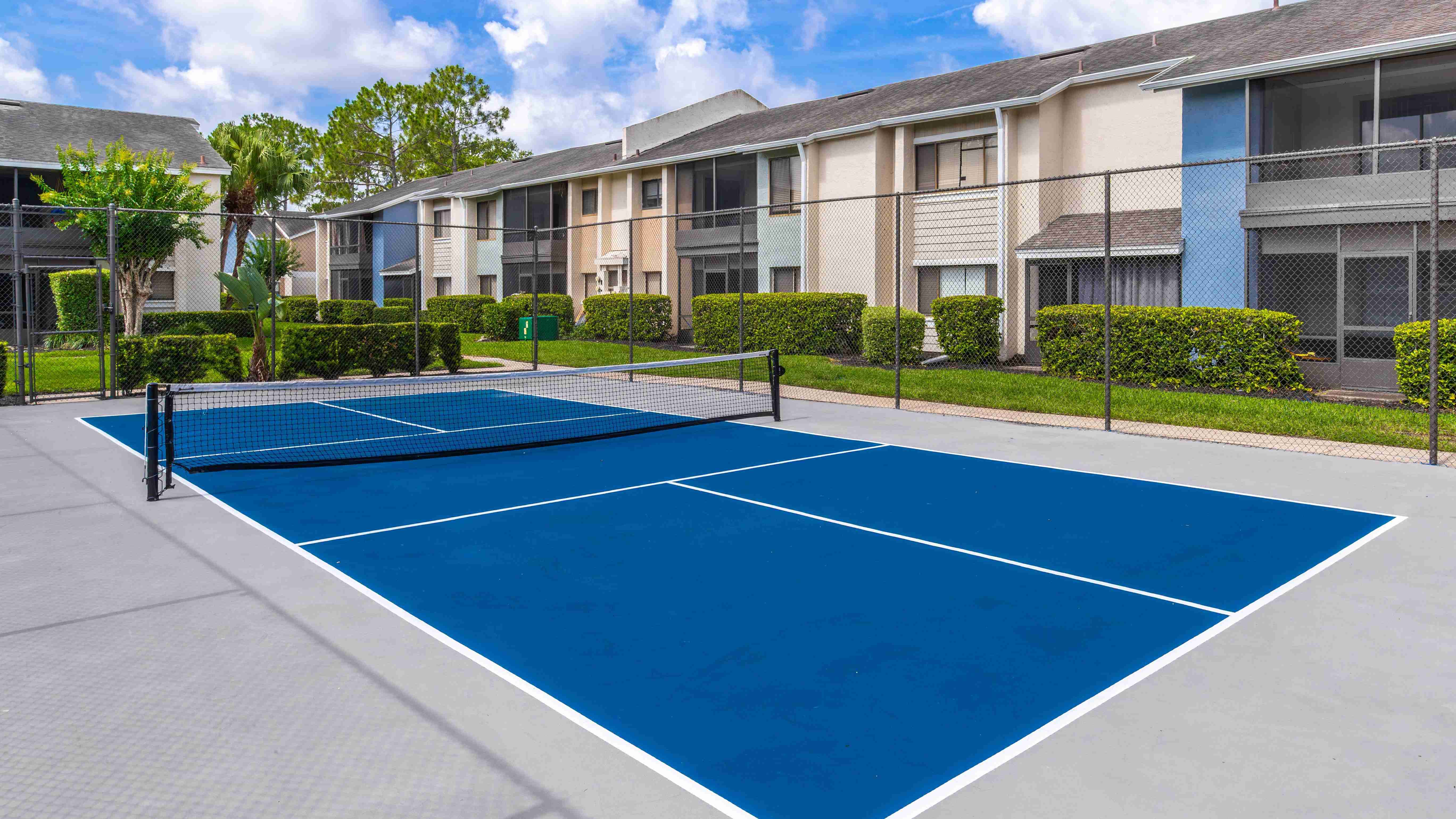 Experience resort-style living at Harper Grand Apartments with access to outdoor recreation including our vibrant pickleball court, perfect for players of all skill levels.