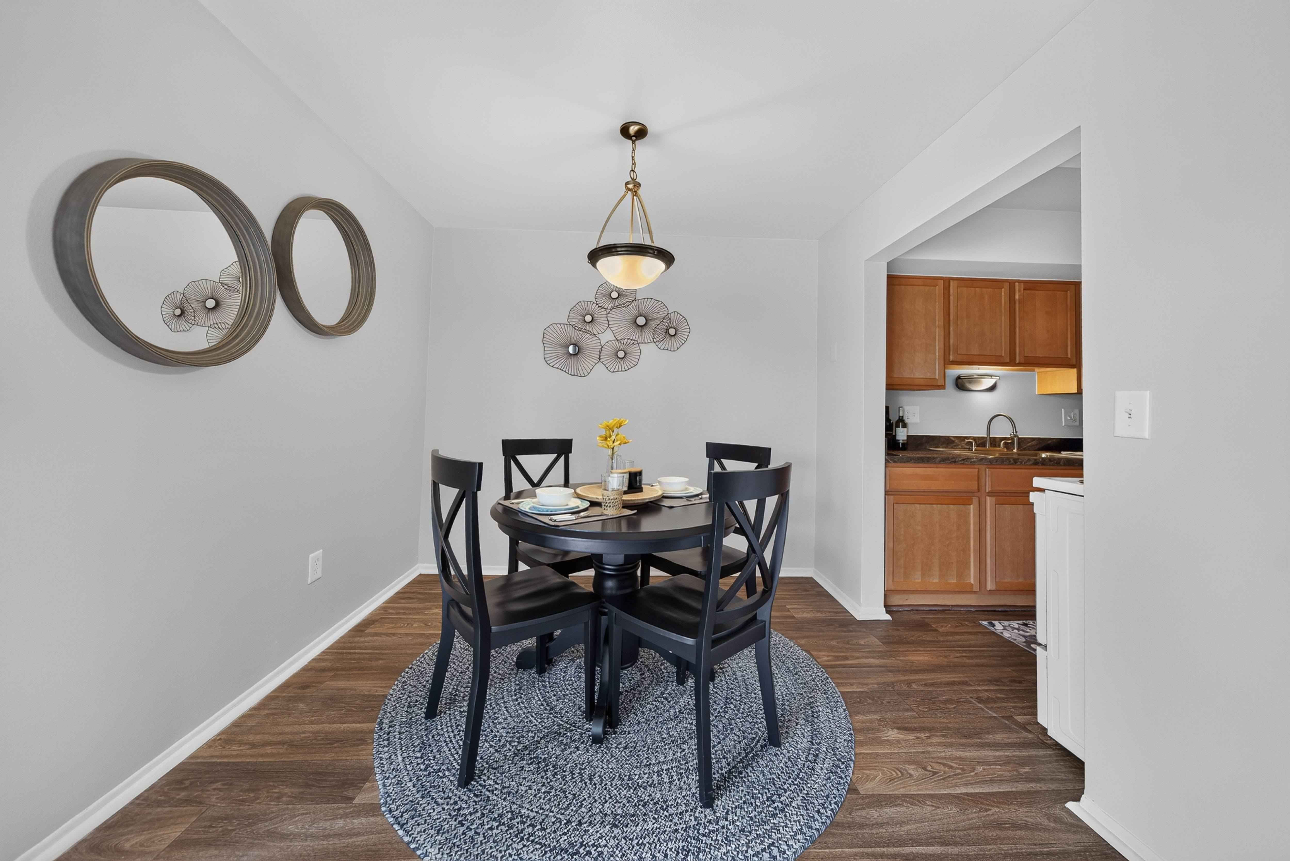 Spacious dining room area at Drawbridge Apartments in Harrison Township, MI.