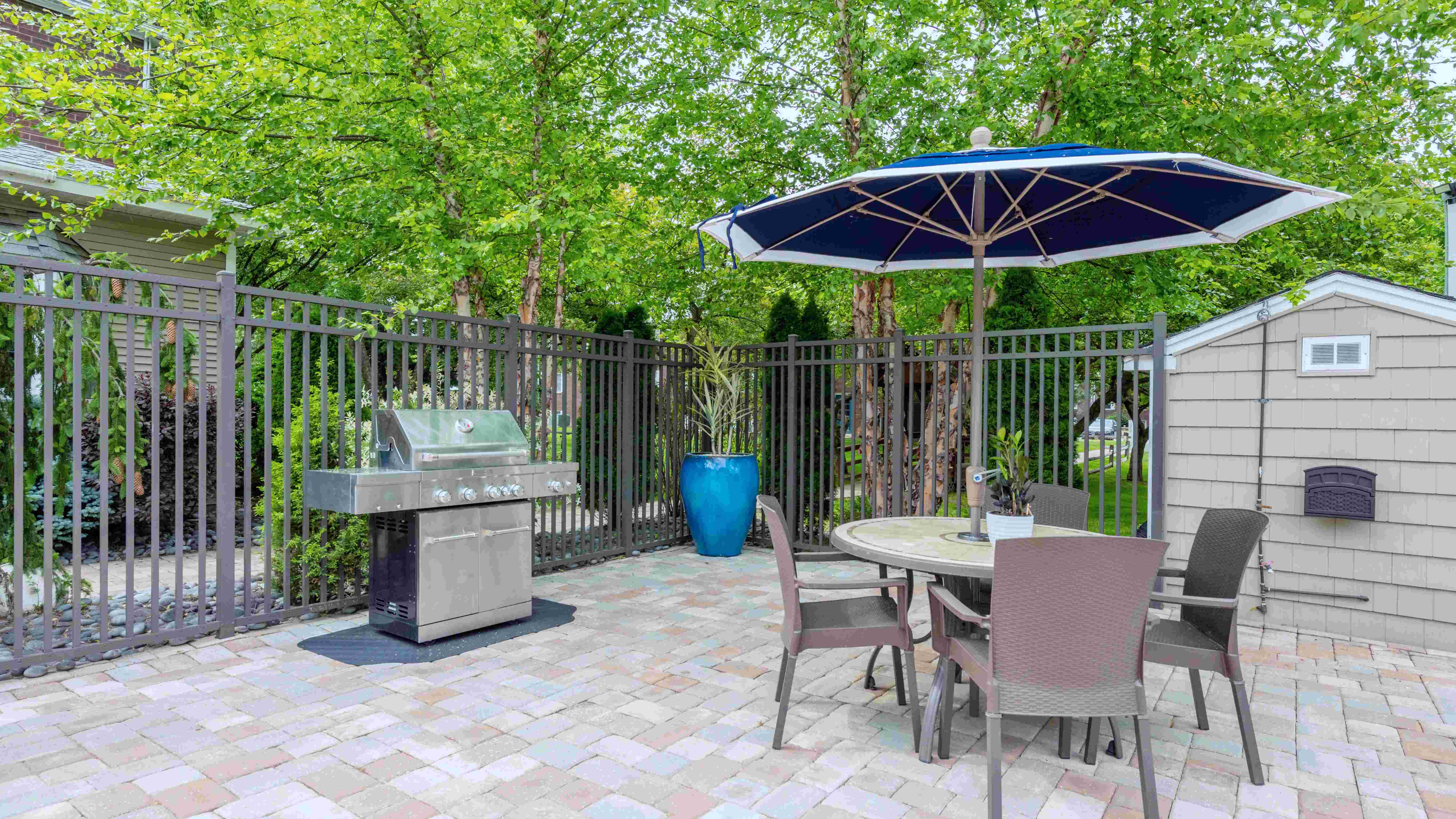 Enjoy a poolside BBQ feast with our sleek gas grill and shaded seating. 