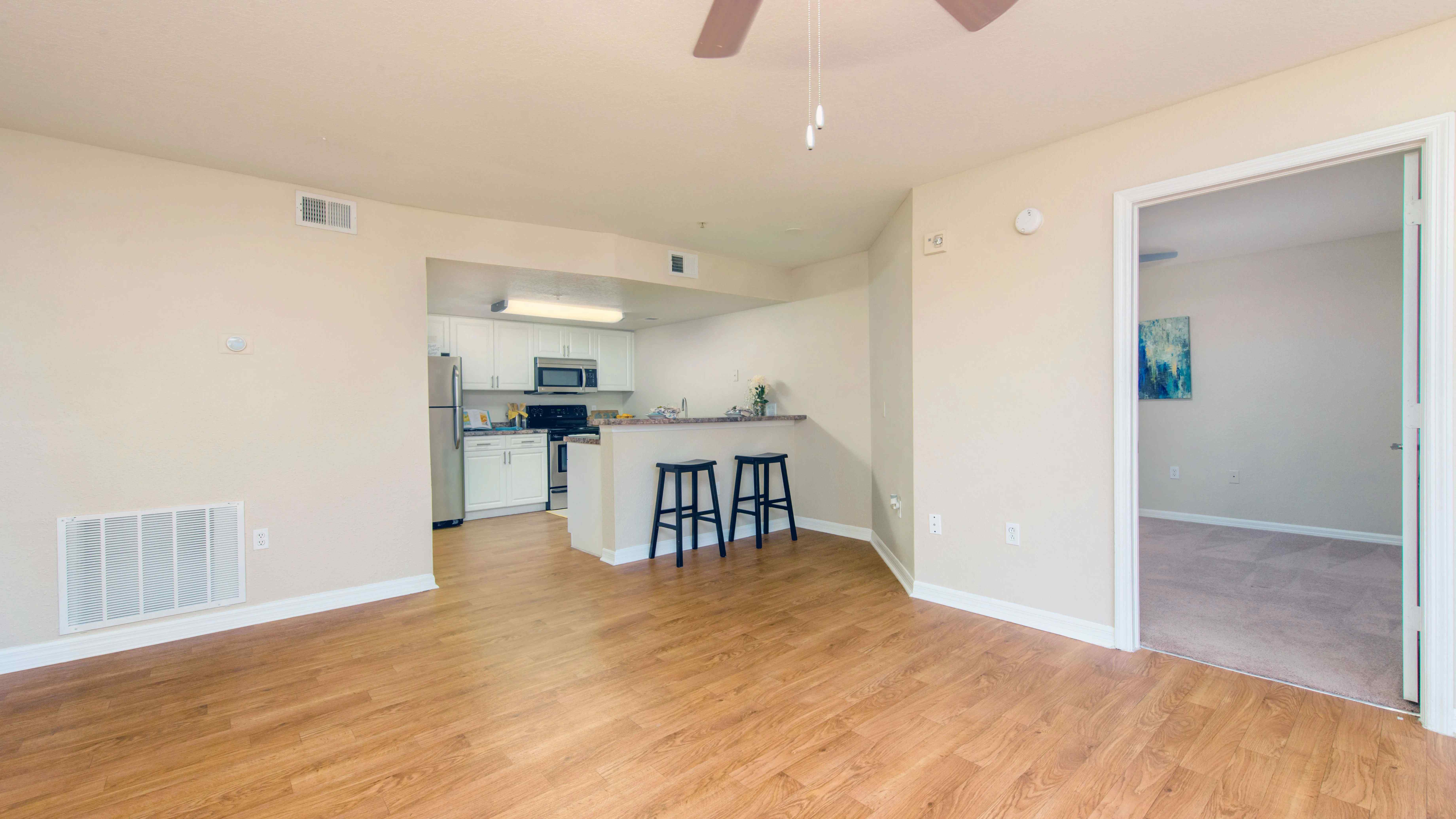 Revel in the airy openness of our floor plans accentuated by sleek wood-style flooring. 