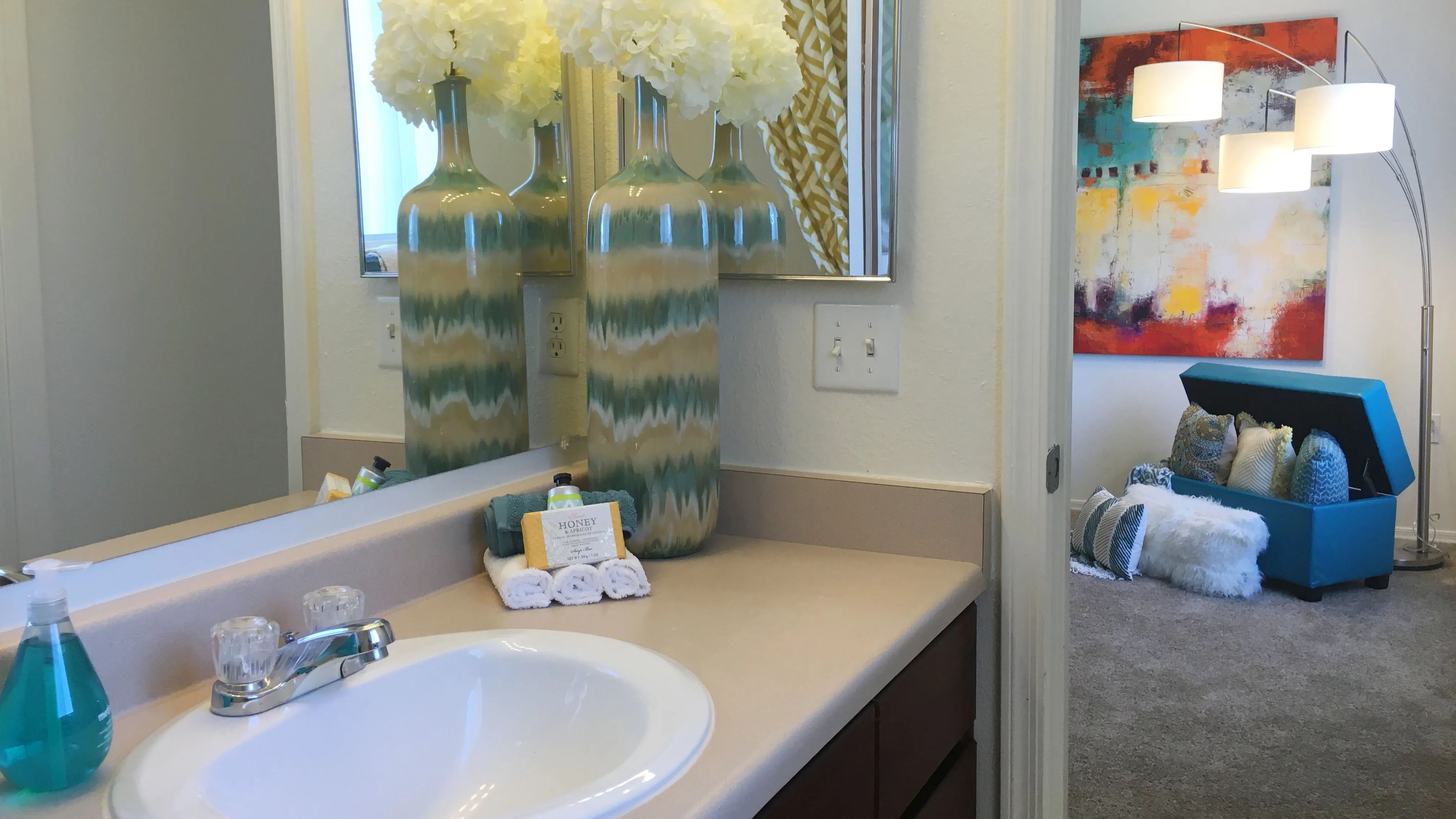 Our ensuite master bathroom features a generous vanity and a stylish, oversized mirror.