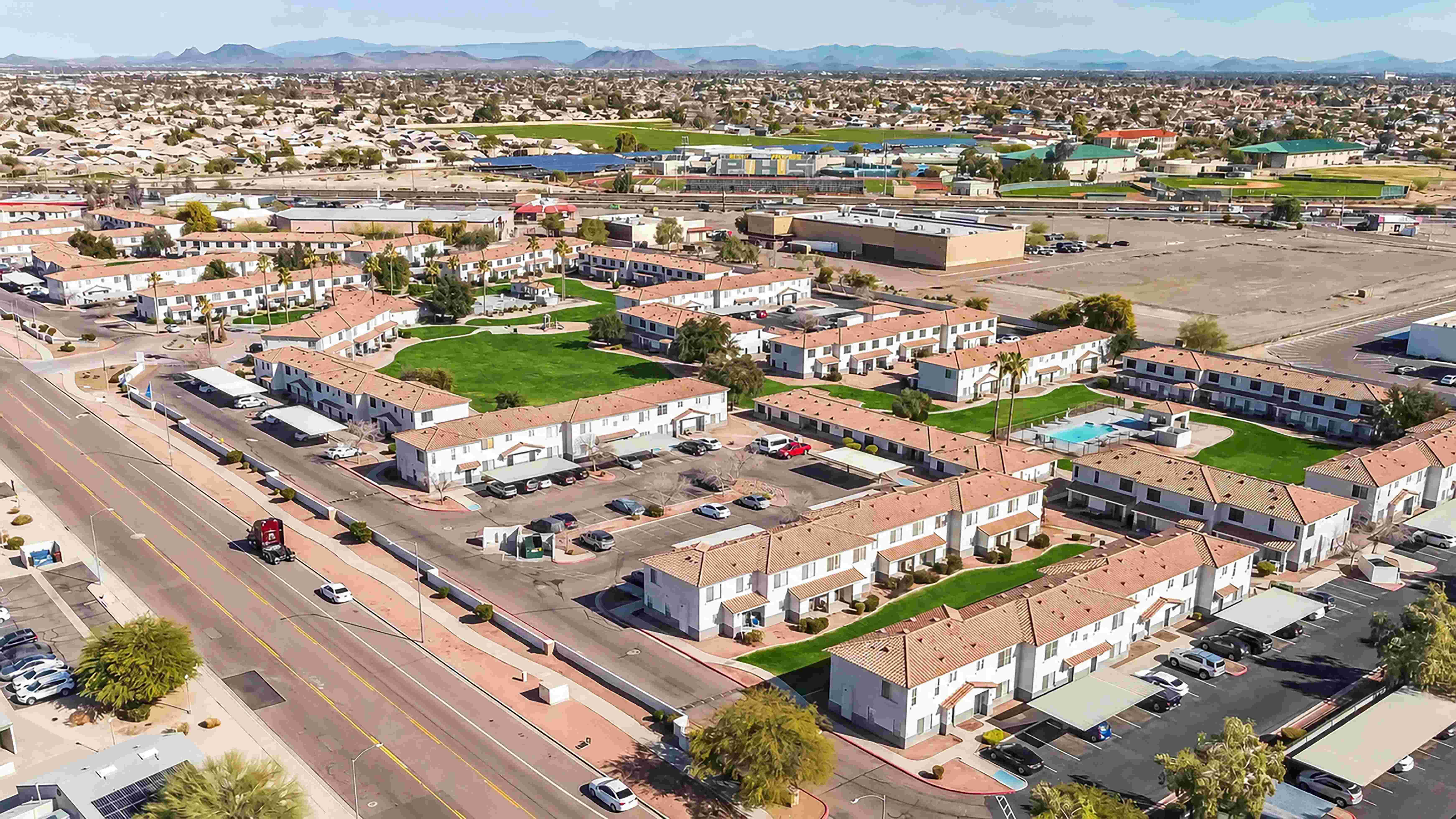 Take in Rancho Del Sol from above, where spacious green areas, mature palm trees, and a sparkling community pool come together to create a relaxing place to call home.