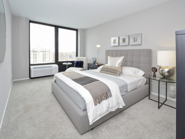 Spacious Bedroom with City Views