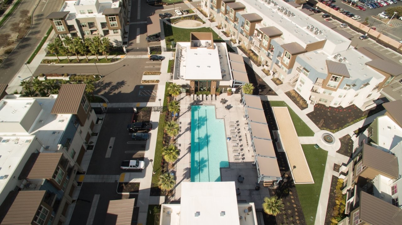 An aerial view of Aspire Apartments in Tracy California, Luxury living with a swimming pool.