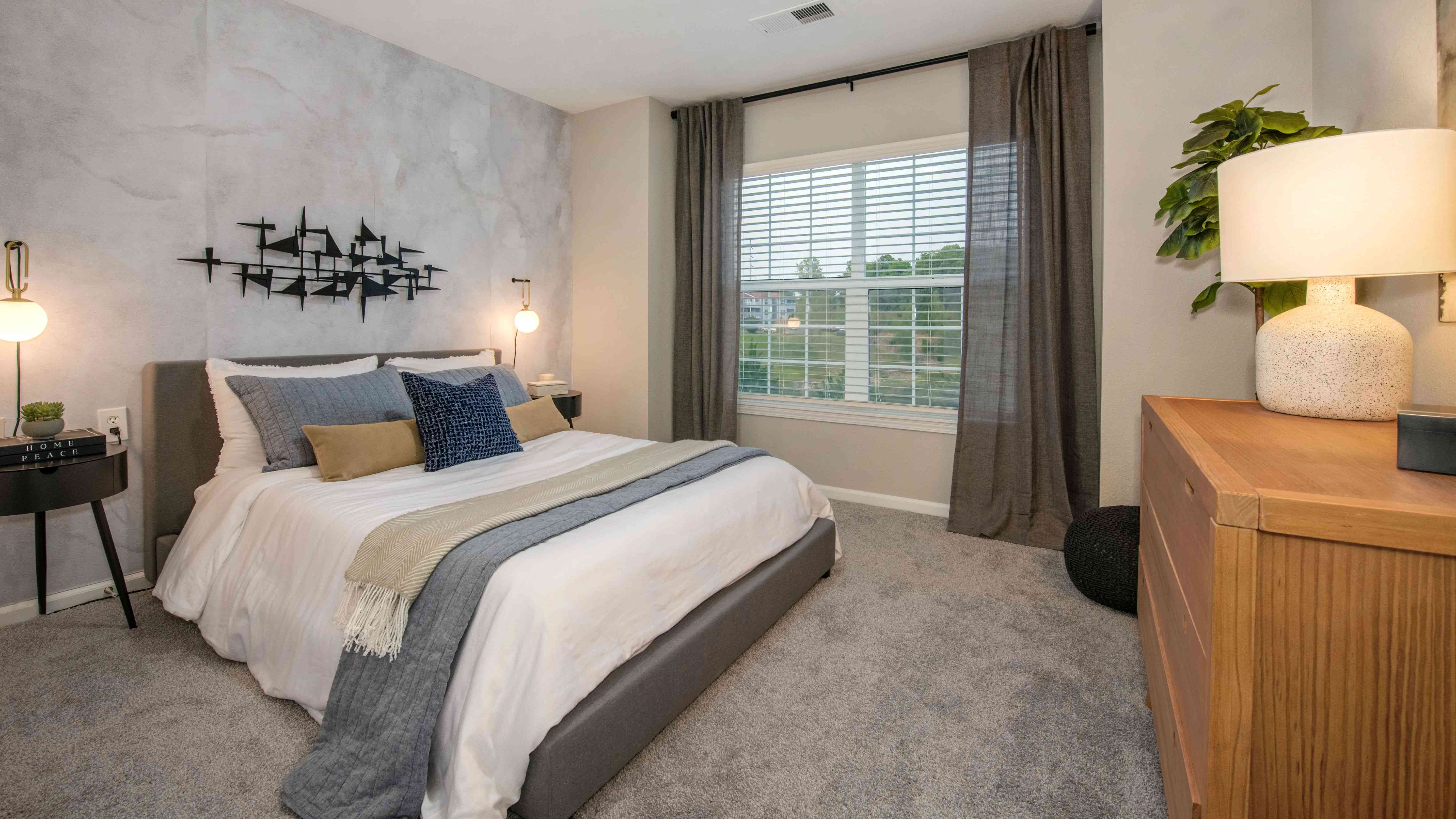Discover lavish guest bedrooms with plush carpeting and ample space for serene living.