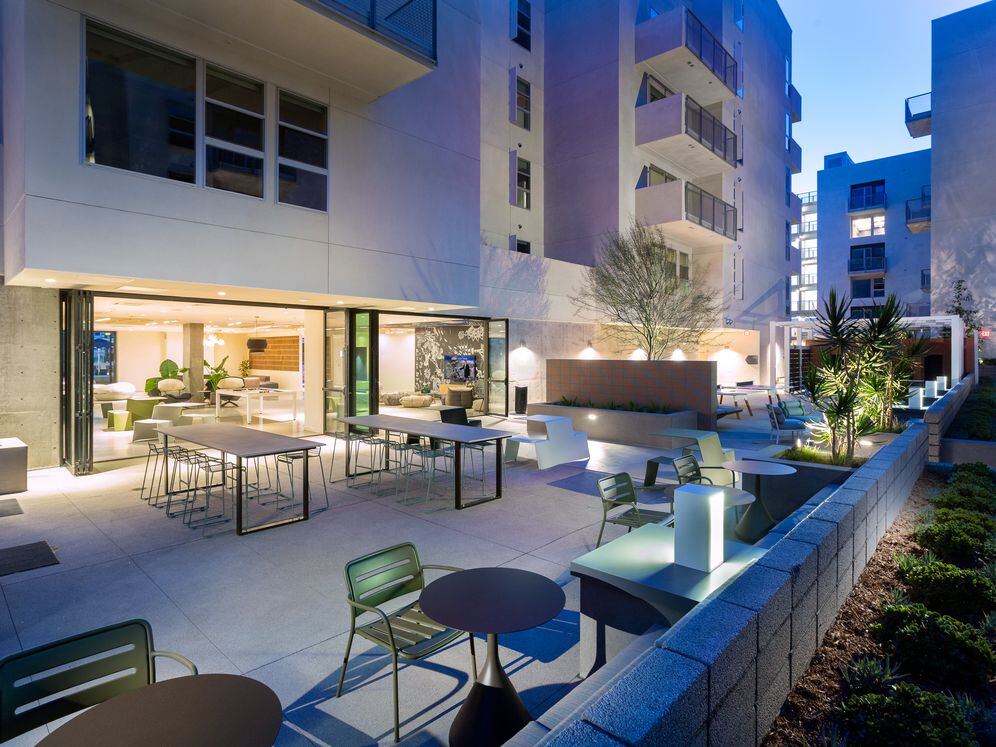 Indoor/outdoor chill space with barbecue grills and seating