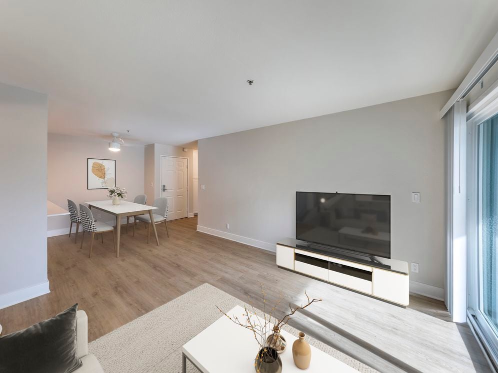 Renovated Package I dining and living room with hard surface flooring