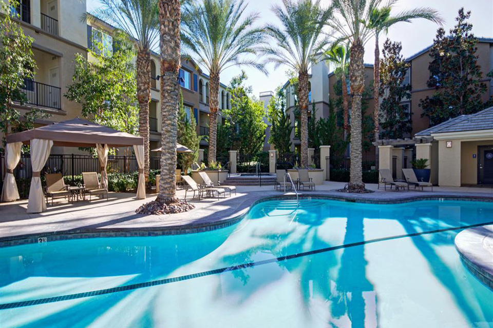 Poolside cabanas create a resort-like atmosphere