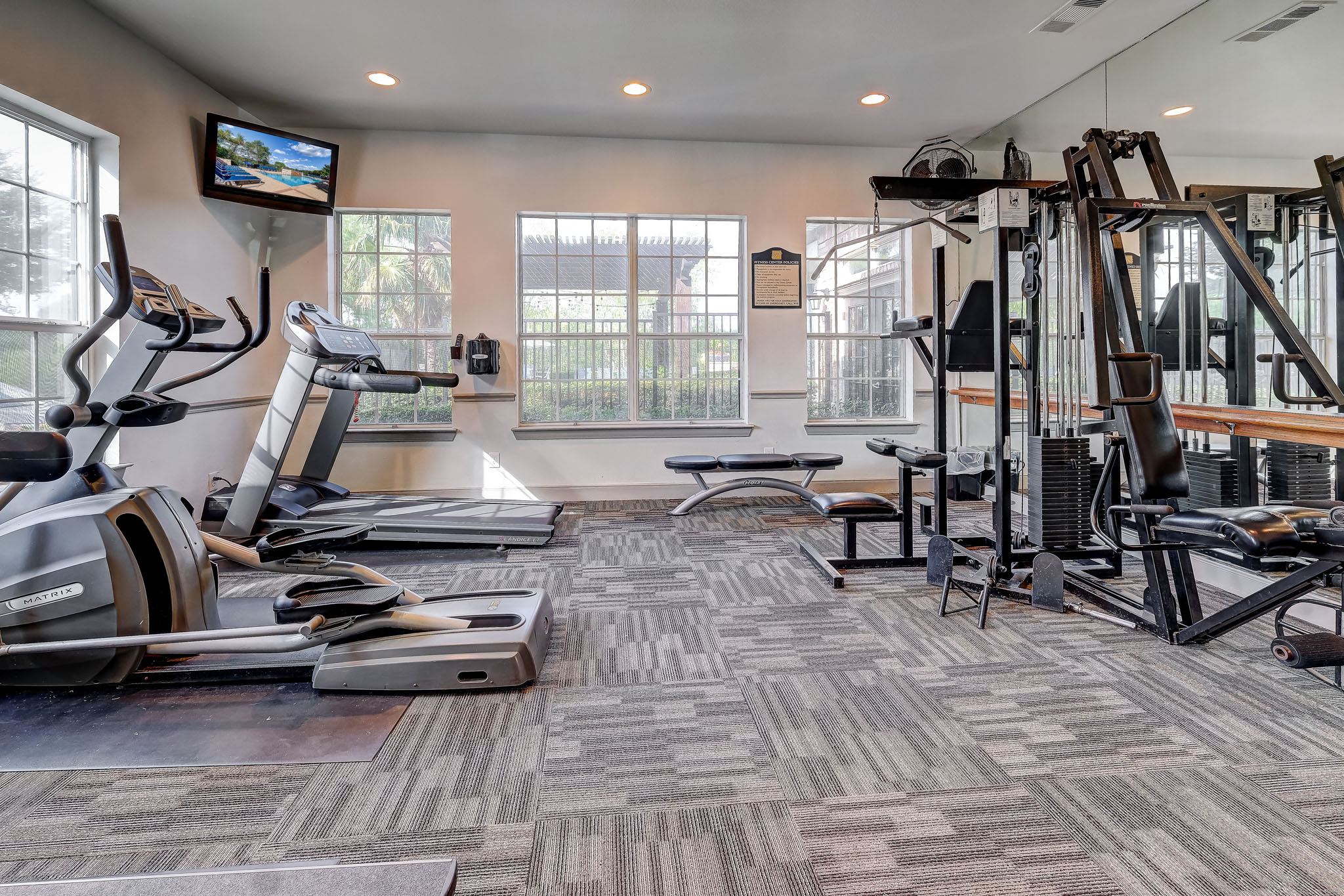 Fitness Center with treadmills and weight machines