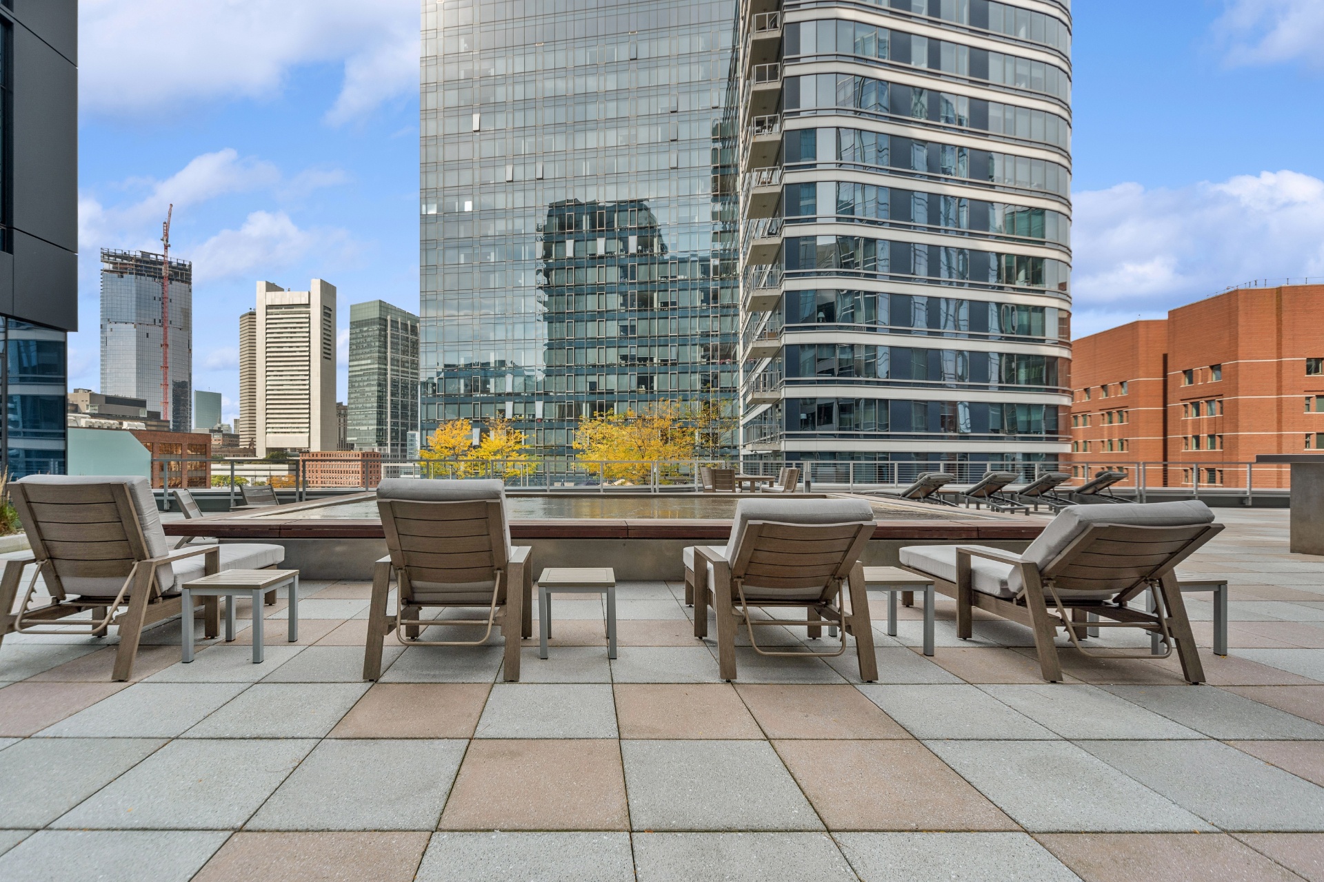Sun Deck Lounging Area with Cityscape Views