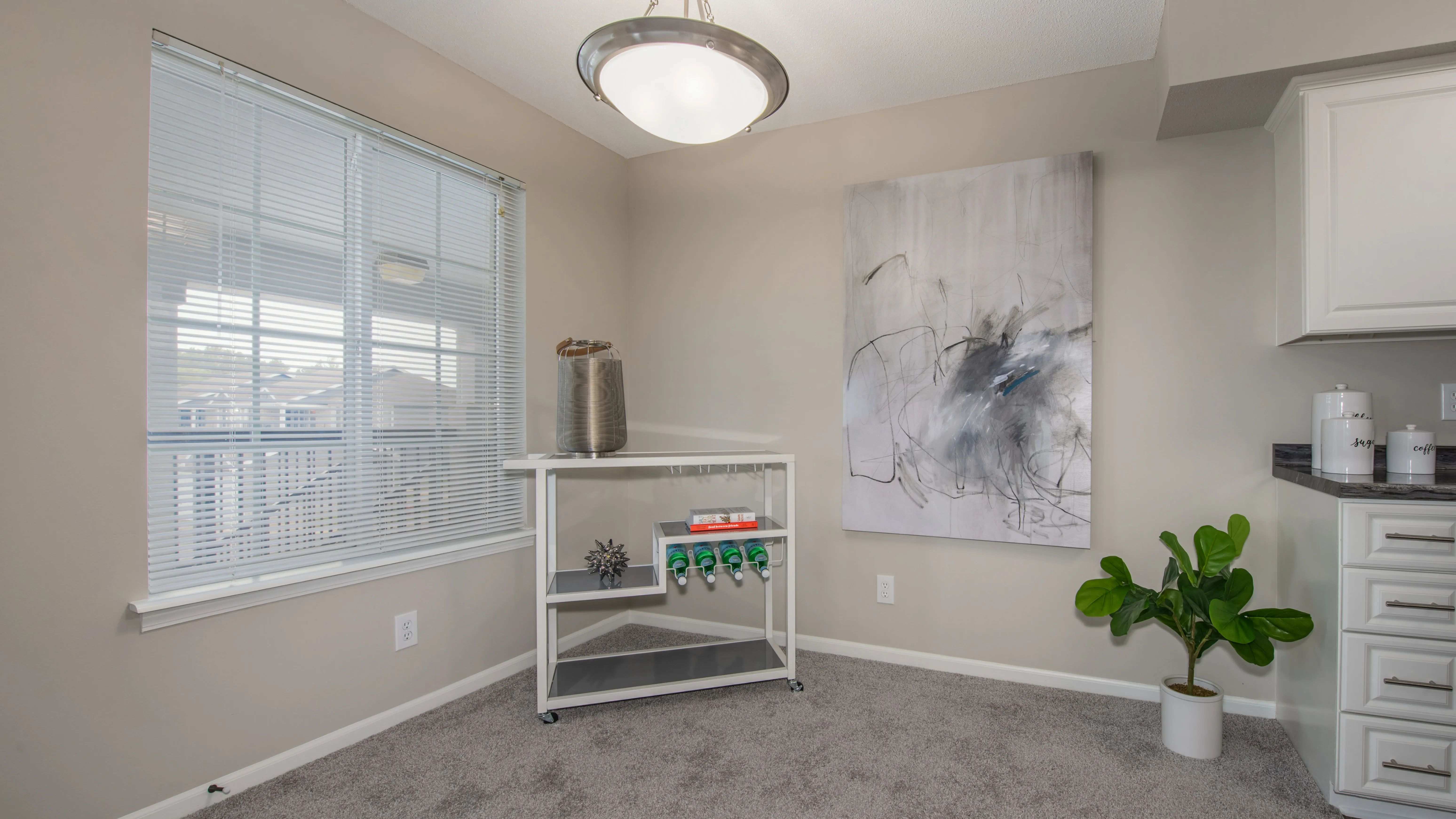 Enjoy meals in a charming dining room adjacent to the kitchen with views of the adjacent living area. 