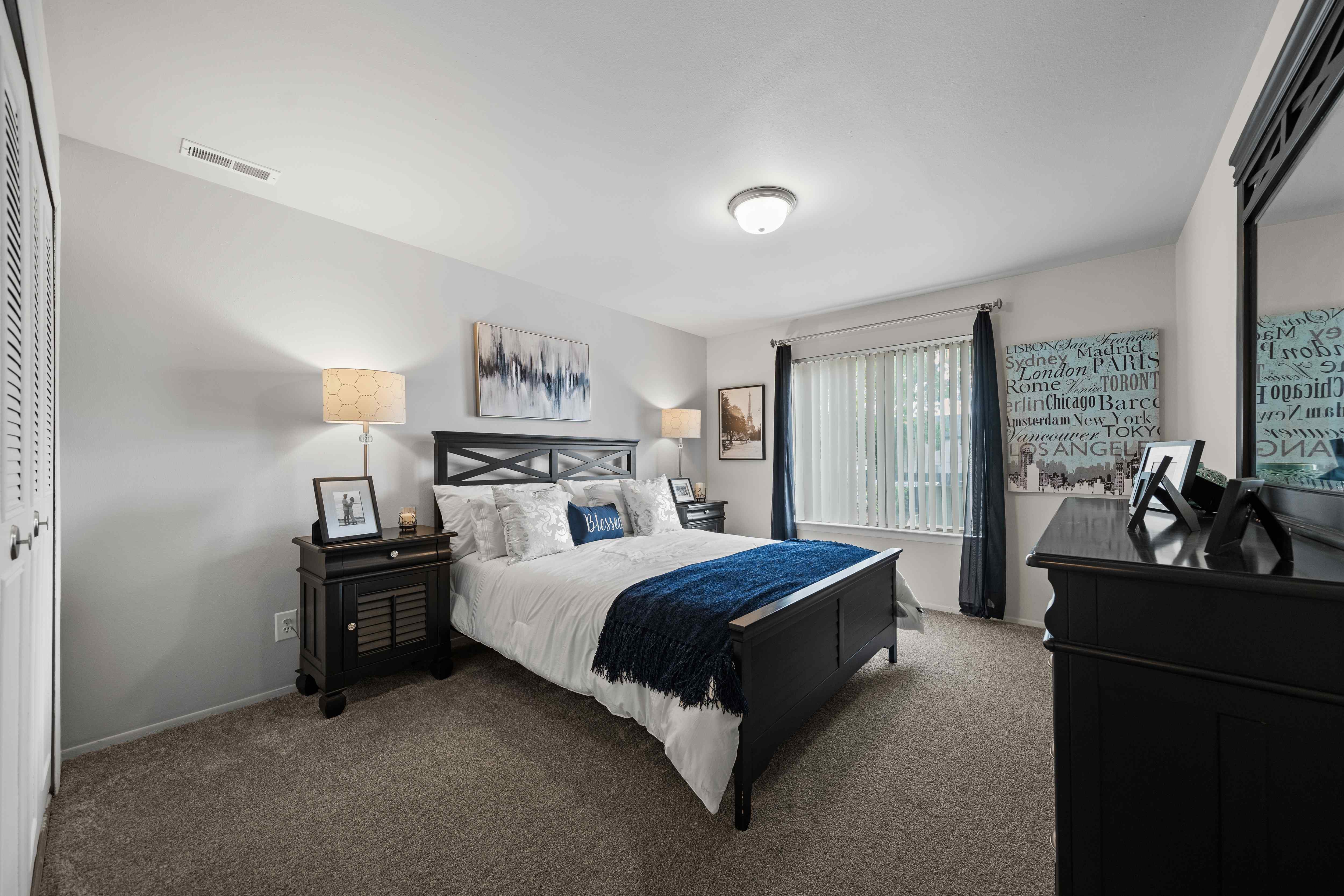 Spacious bedroom with ample storage space at Knottingham Apartments in Clinton Township, MI.