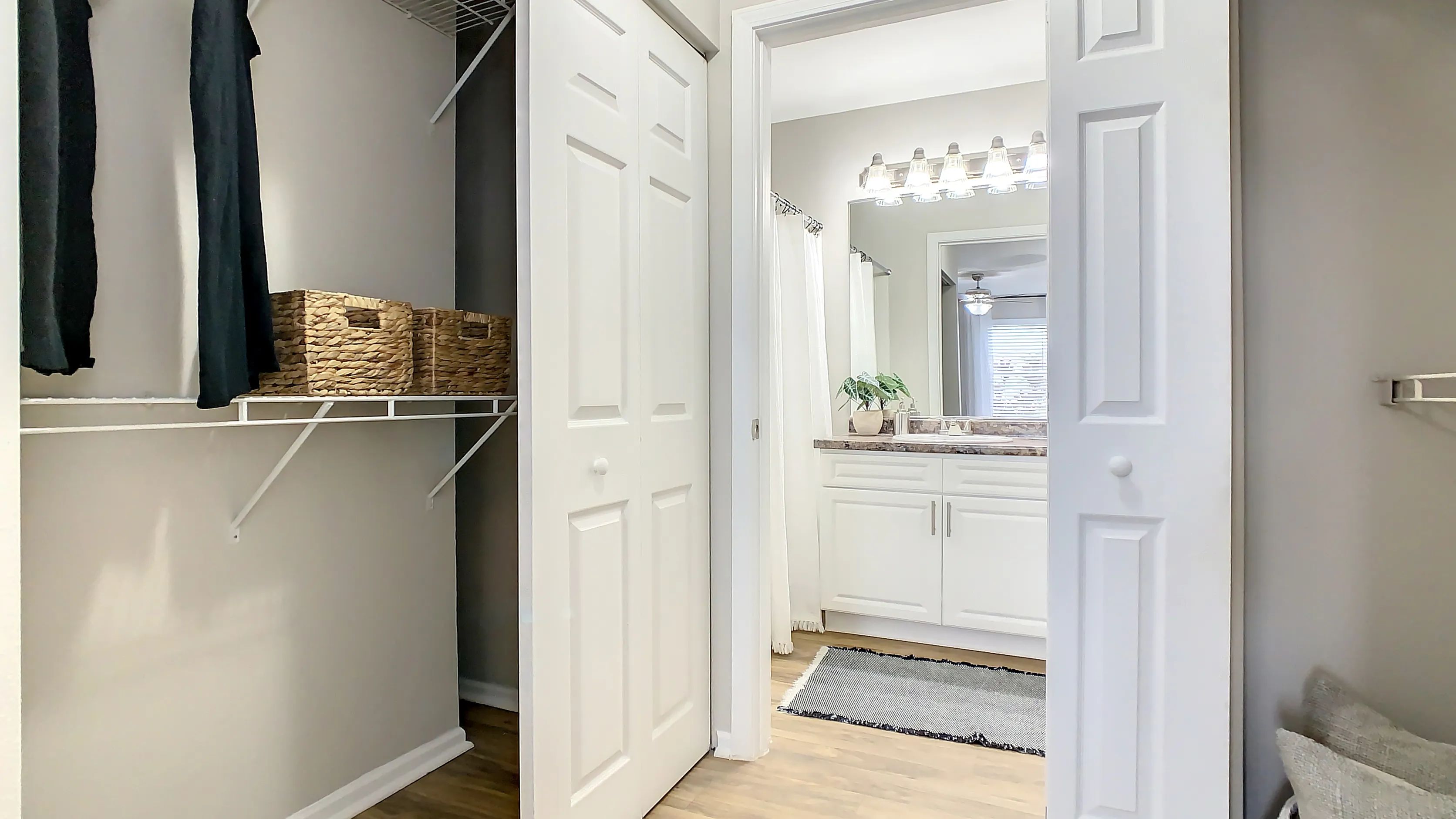 Marvel at the lavish primary bedroom’s walk-through closet, offering stylish yet practical storage solutions in this seamless and elegant space. 