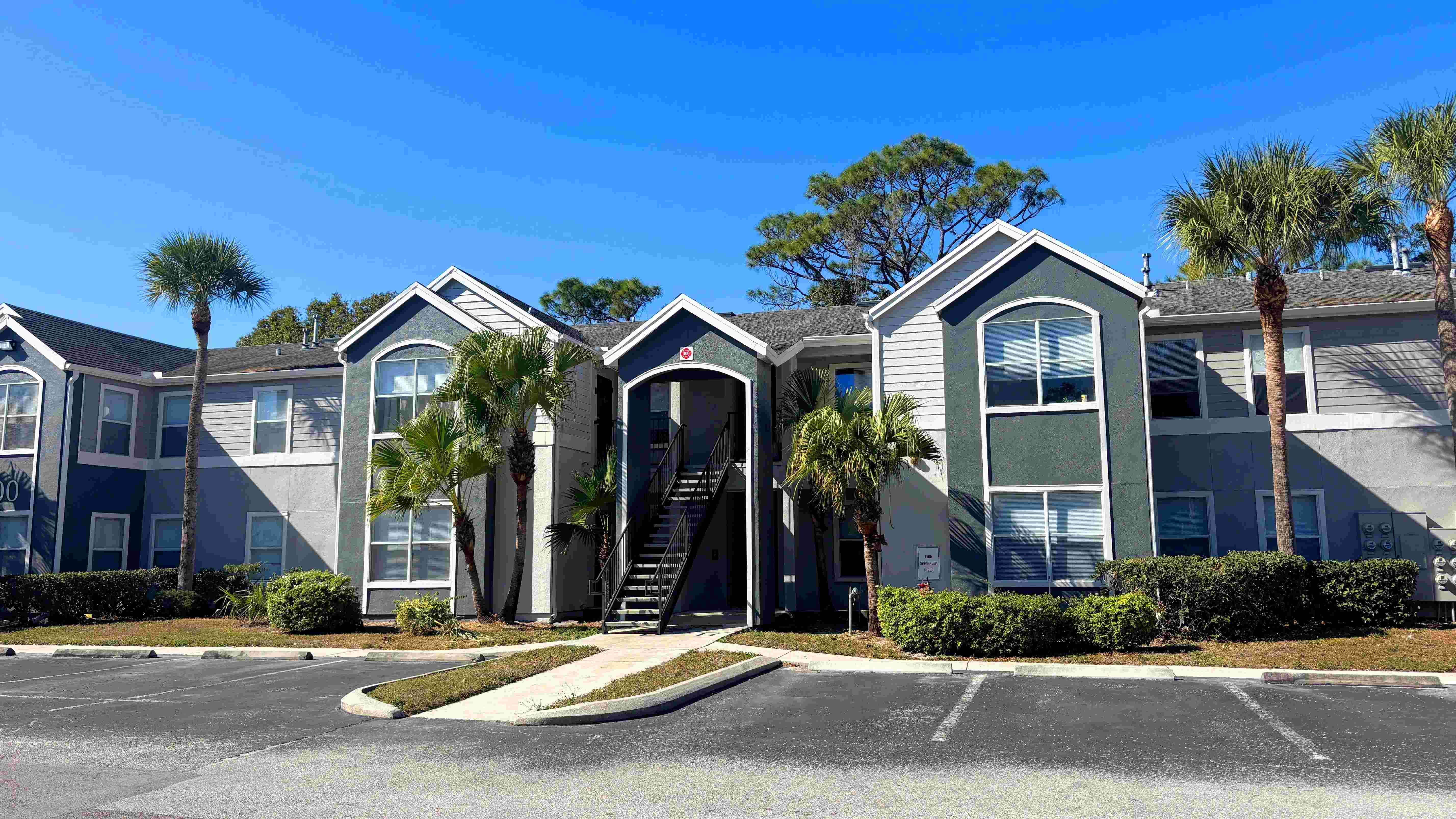 Modern paint, mature landscaping, and Florida palms welcome you home at Eden Pointe.