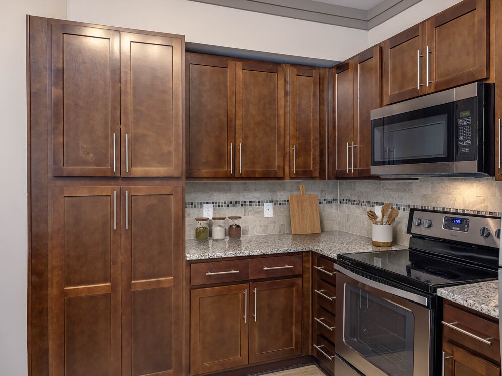 Modern kitchens with stainless steel appliances and granite countertops