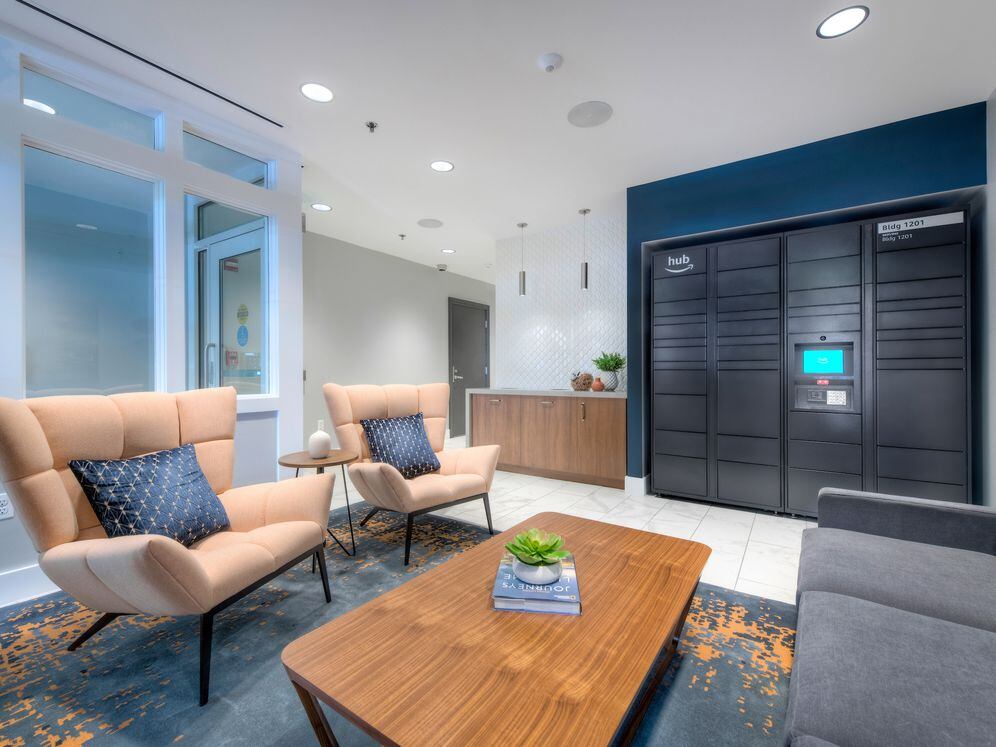 1201 building lobby with seating and Amazon HUB package locker system