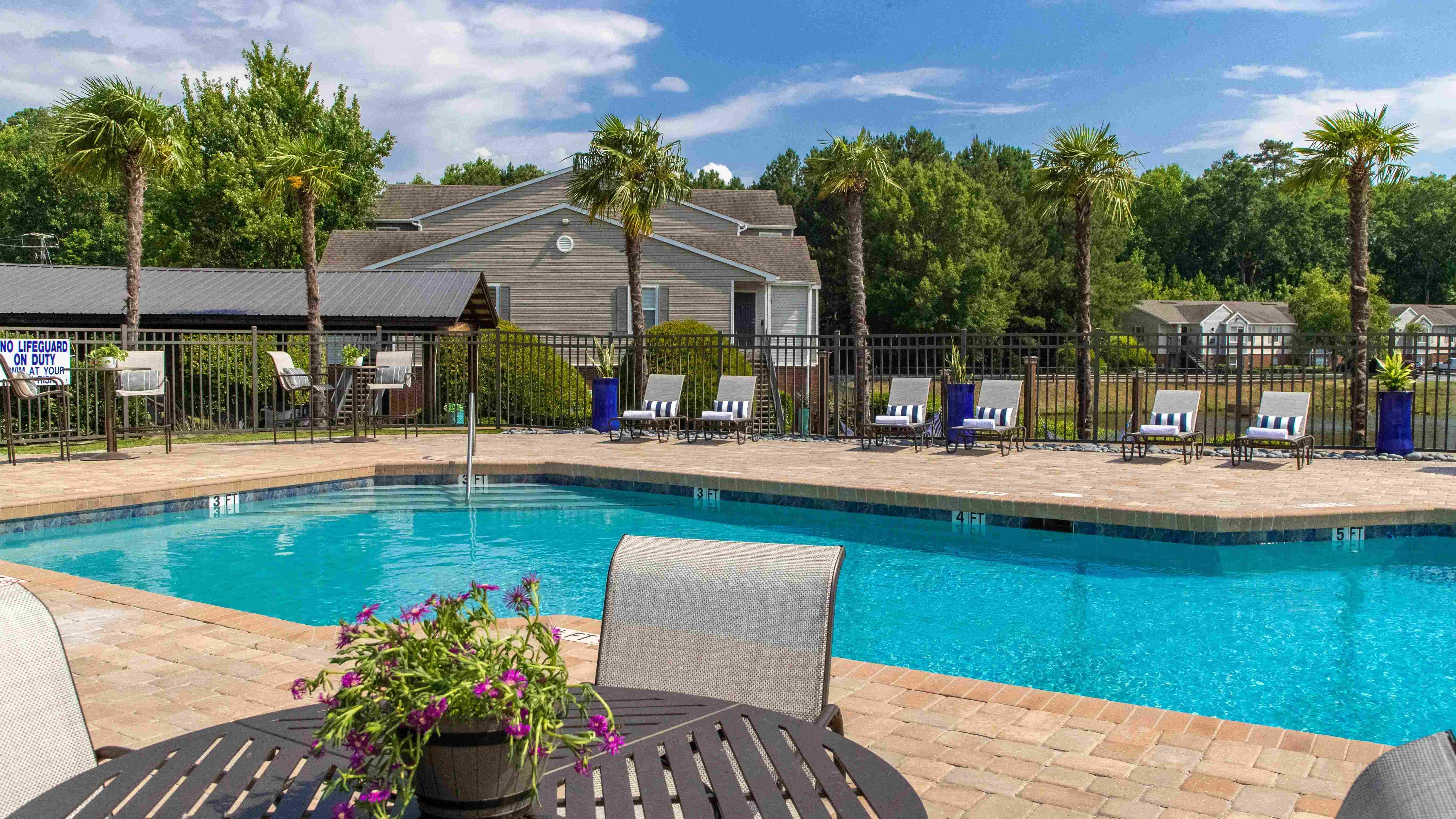 Enjoy a swim in our generously-sized resort-style pool, surrounded by serene lake views. 