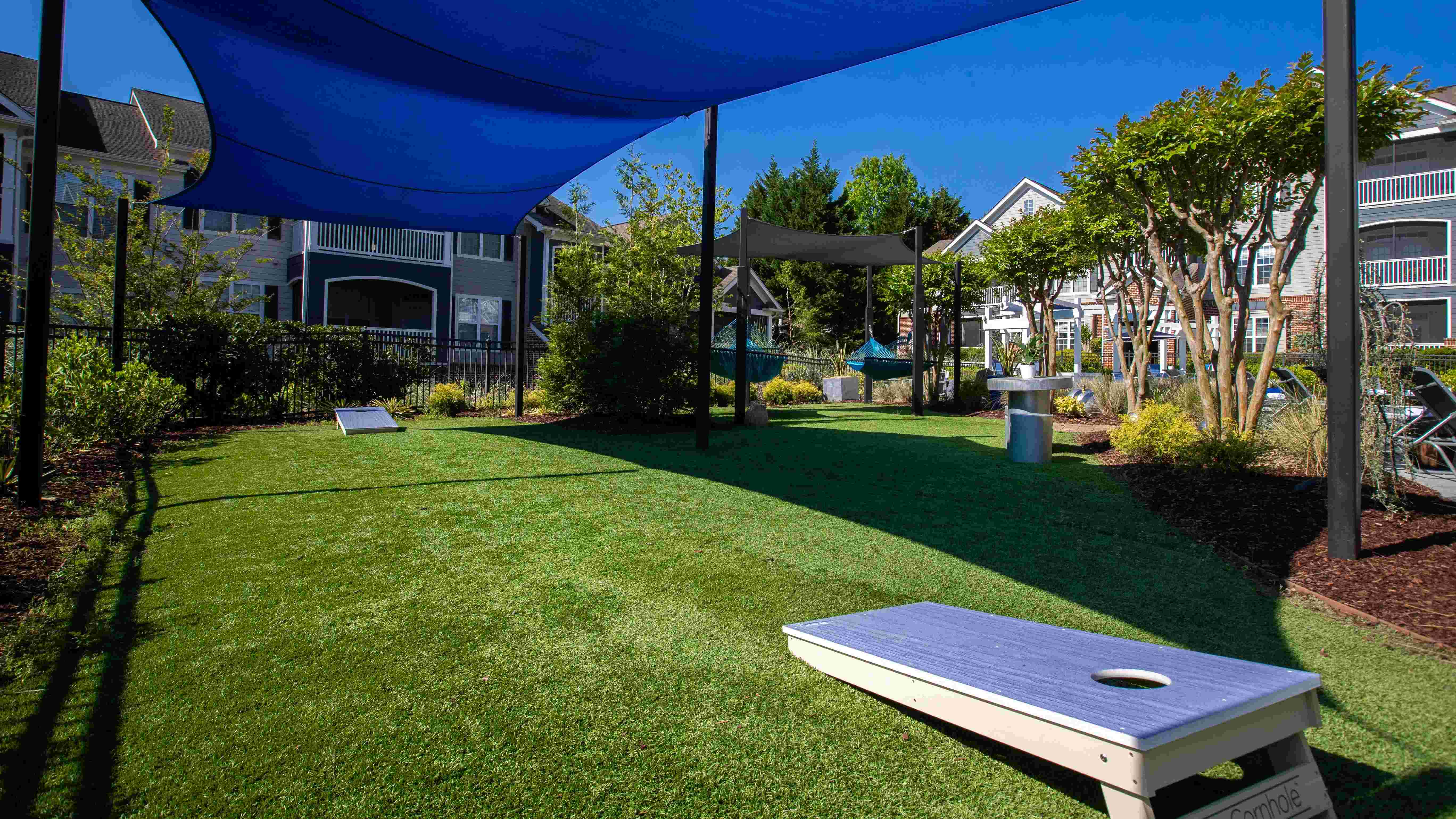 Engage in a spirited game of cornhole amidst the vibrant buzz of The Everlee's dynamic pool deck.