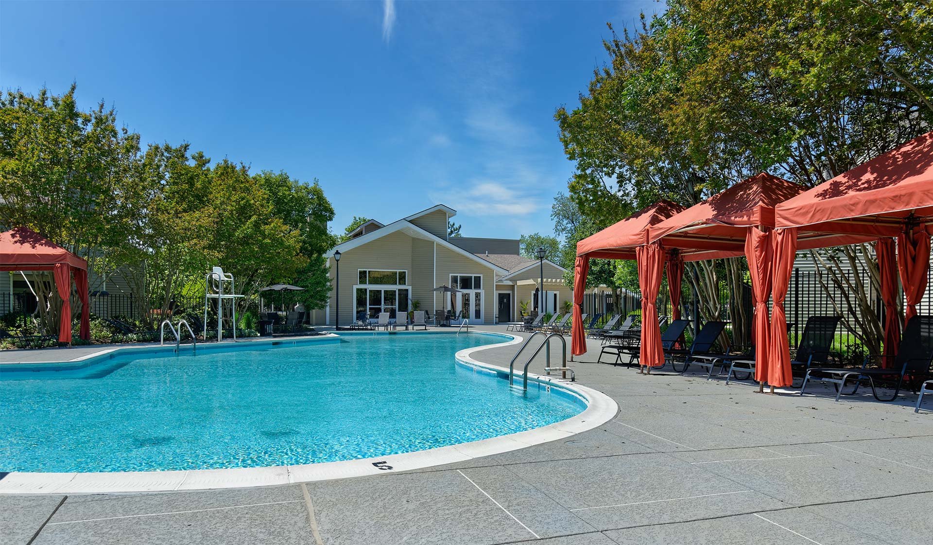 Relax by the pool underneath one of our cabanas