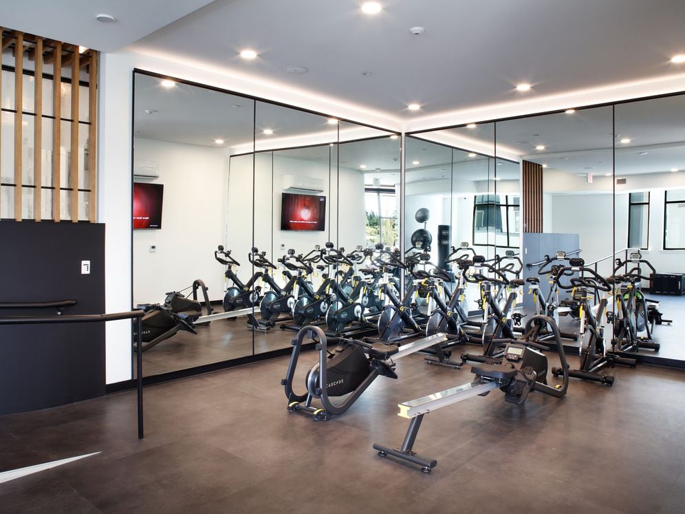 Fitness studio with spin bikes and cardio equipment