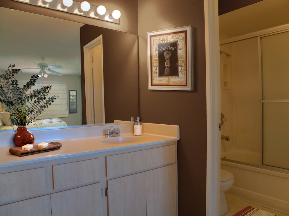 Classic Package I bath with oak cabinetry, and white laminate countertops