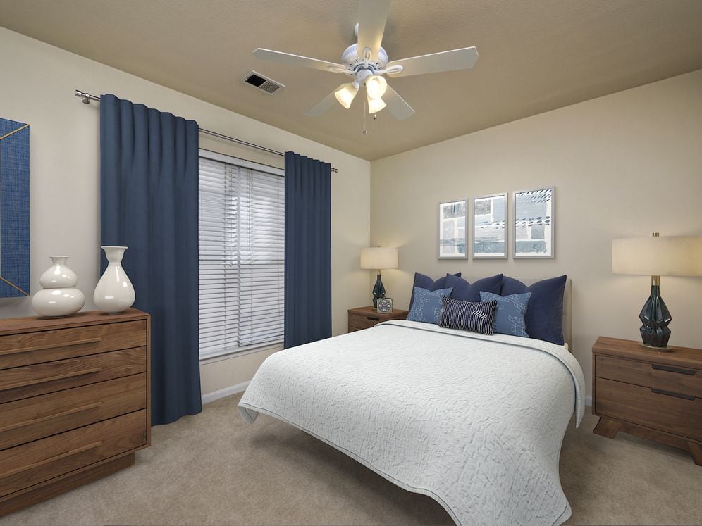 Renovated Package I bedroom with ceiling fan and carpeted flooring