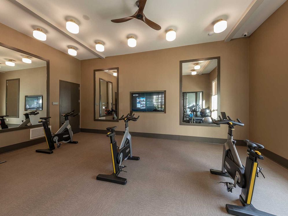 East building fitness studio with spin bikes and virtual fitness programming