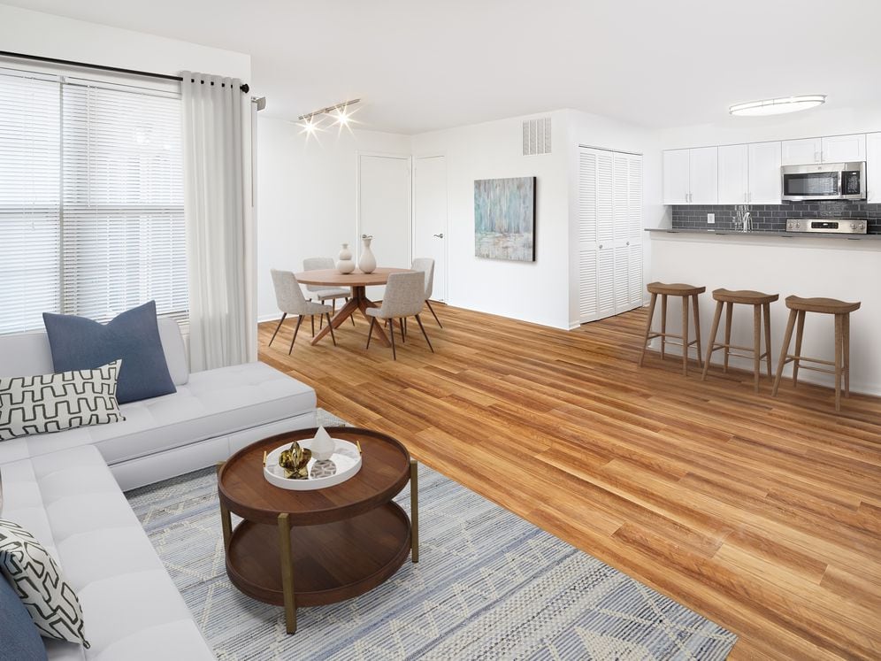 Renovated Package I dining and living room with hard surface flooring