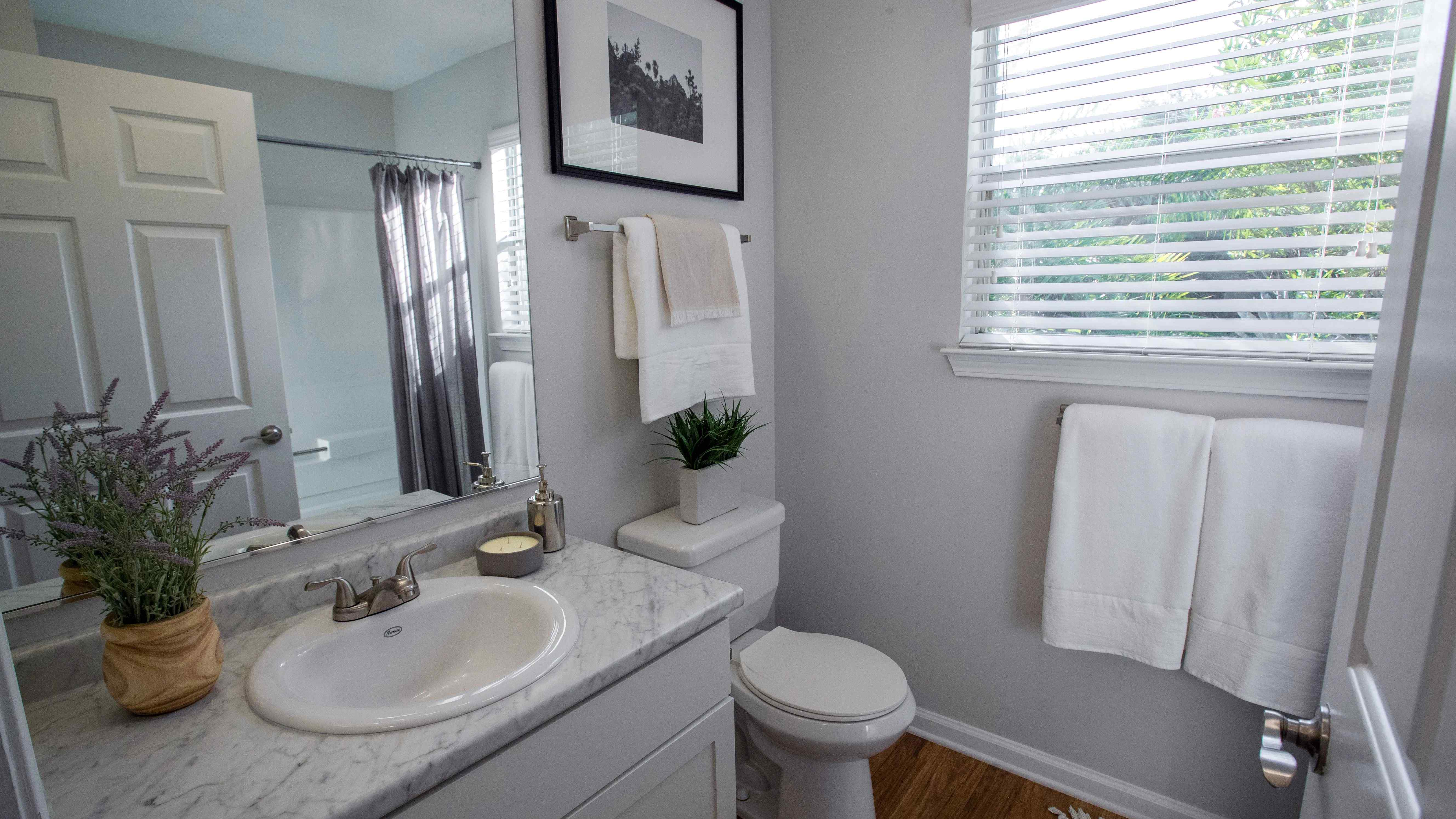 Enjoy natural lighting while you get ready in our spa-like bathroom with window and stylish features throughout.