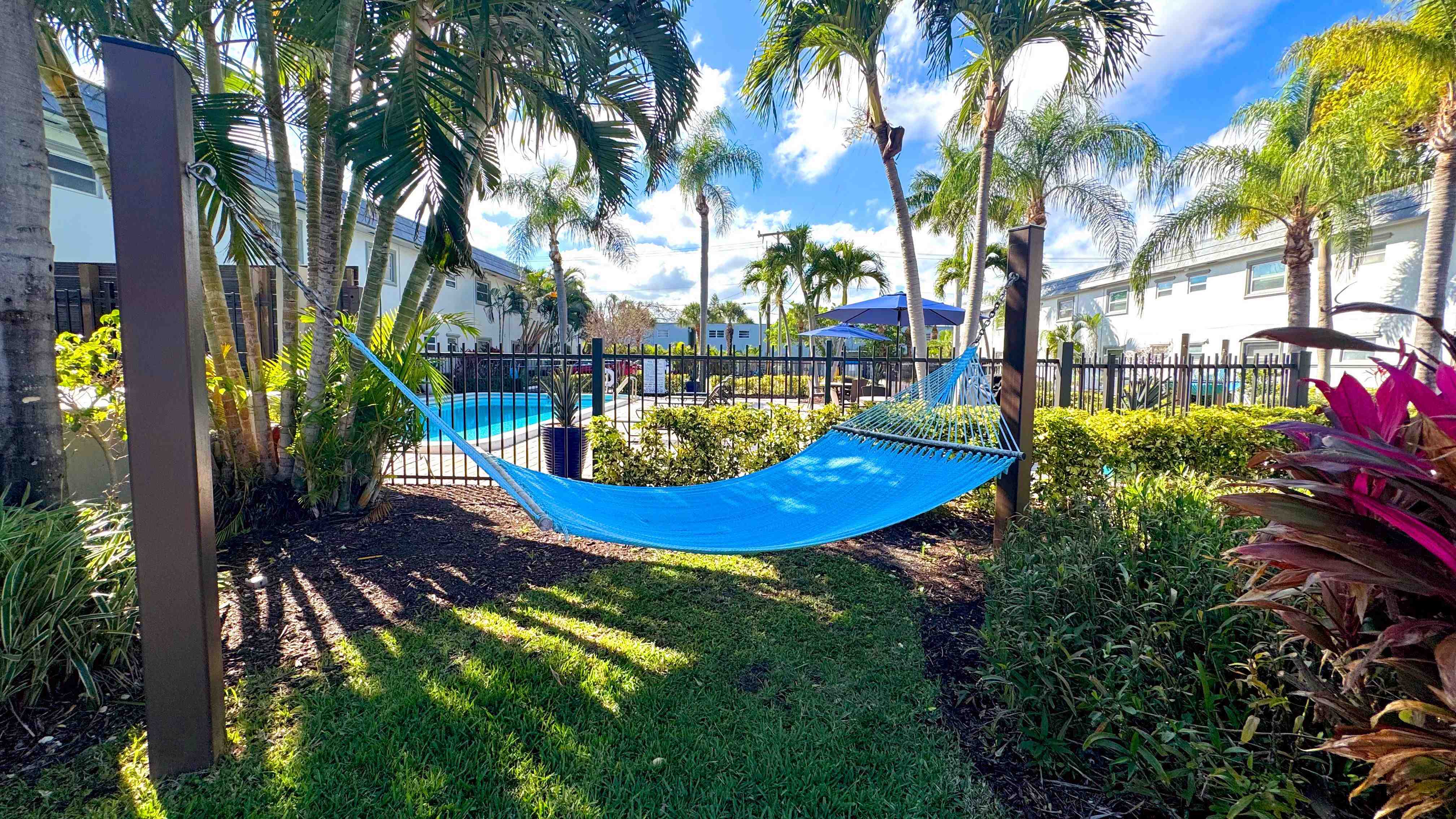 Enjoy the ultimate relaxation in a shaded hammock with a perfect view of the sparkling pool.