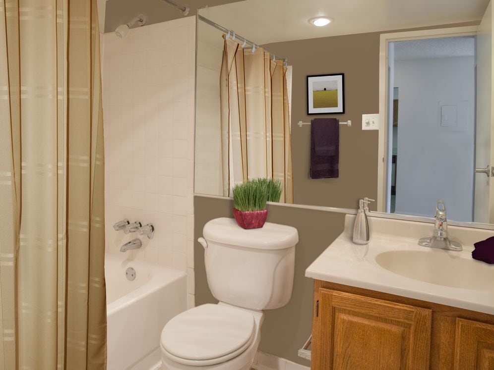 Bathroom with white countertop and tile floor