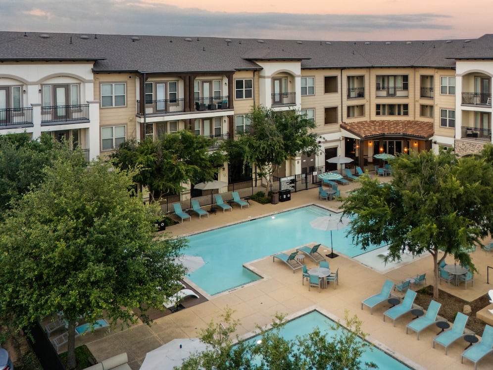 Pool, sundeck, and courtyard