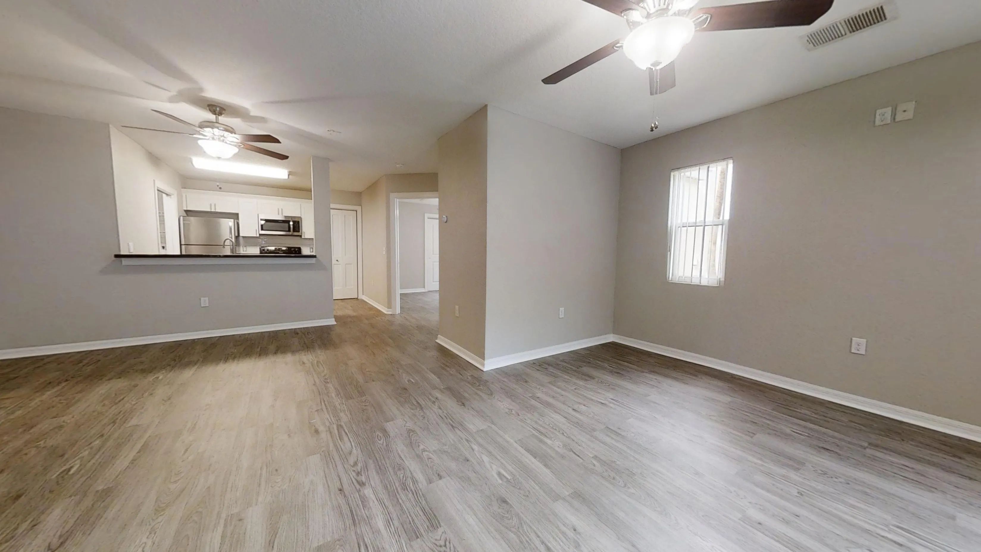 The Chateau floor plan offers generous living space, ceiling fans, and a stylish kitchen with stainless steel appliances.