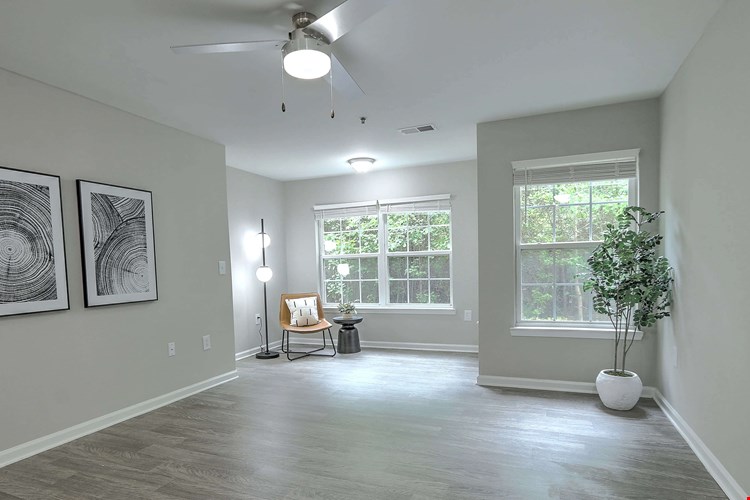 Spacious living room with a dedicated area for an at-home office or a reading nook.