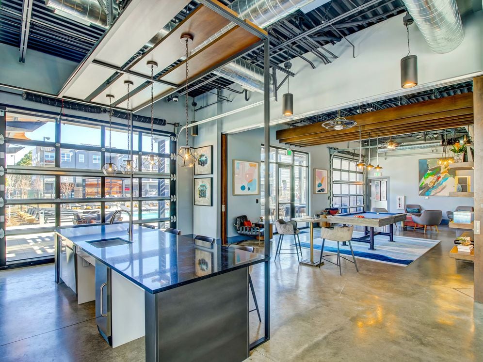 Resident's clubhouse with entertaining kitchenette, flat-screen television, billiards, and more