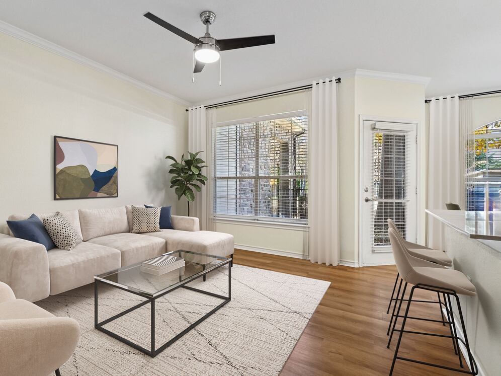 Renovated Package I living room with hard surface flooring