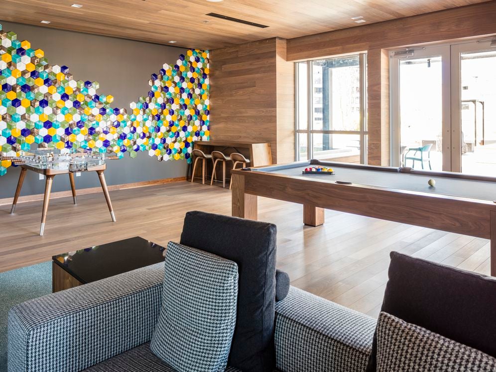 7th floor lounge with multiple seating areas and game area.