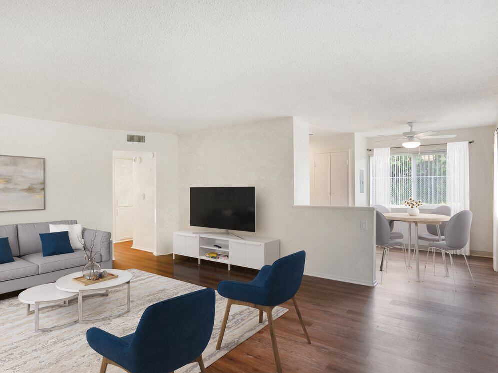 Renovated Package I living and dining area with hard surface flooring