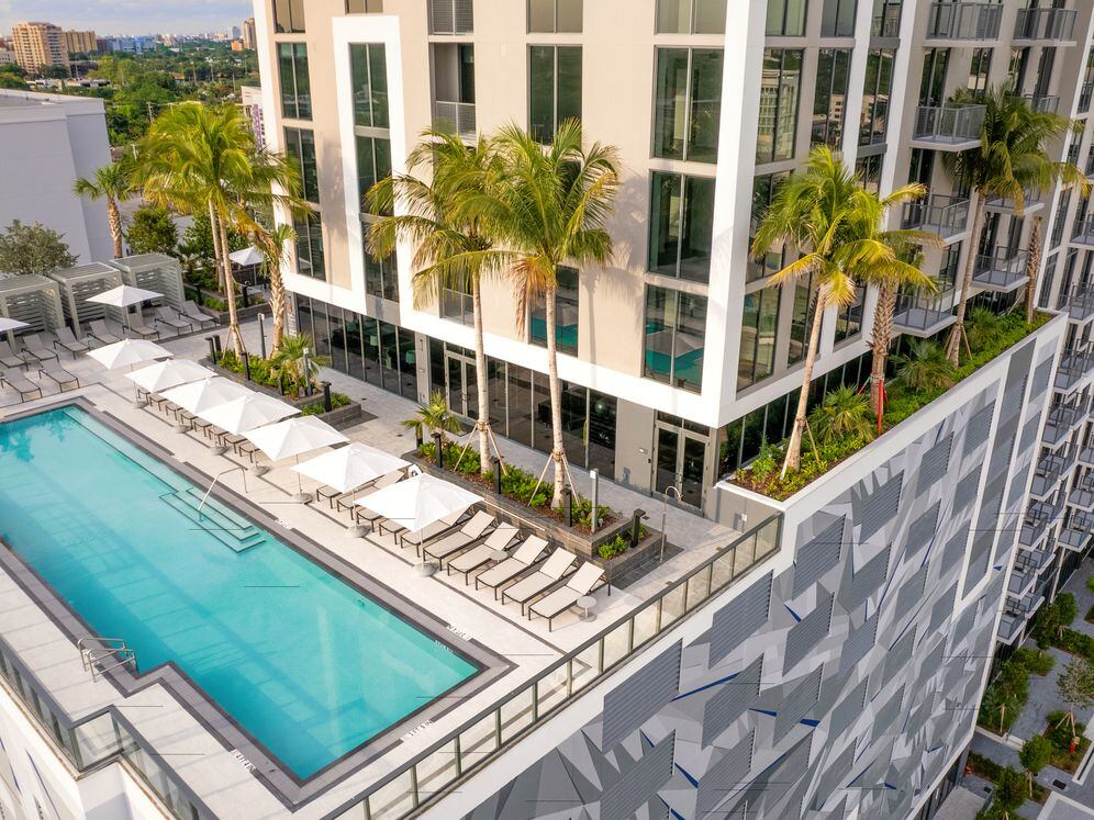 Swimming pool, sundeck, and building exterior